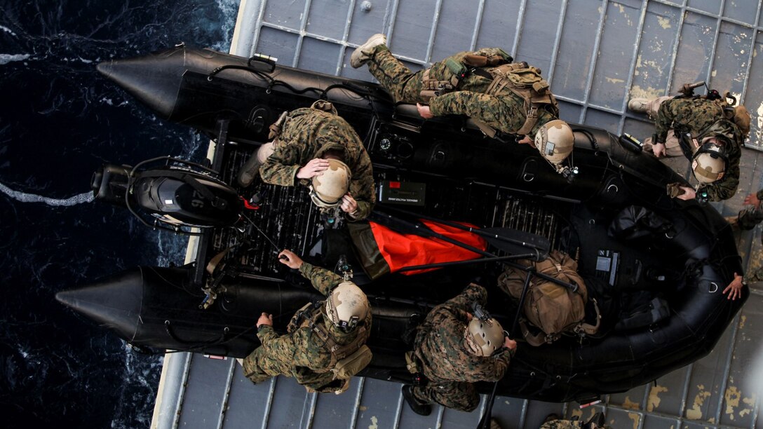 U.S. Marines with the 15th Marine Expeditionary Unit’s Maritime Raid Force prepare to depart USS Essex on a combat rubber raiding craft during Amphibious Squadron Three/Marine Expeditionary Unit Integration Training off the coast of San Diego March 4, 2015. The MRF used CRRCs during a precision raid exercise in preparation for their deployment later this spring.