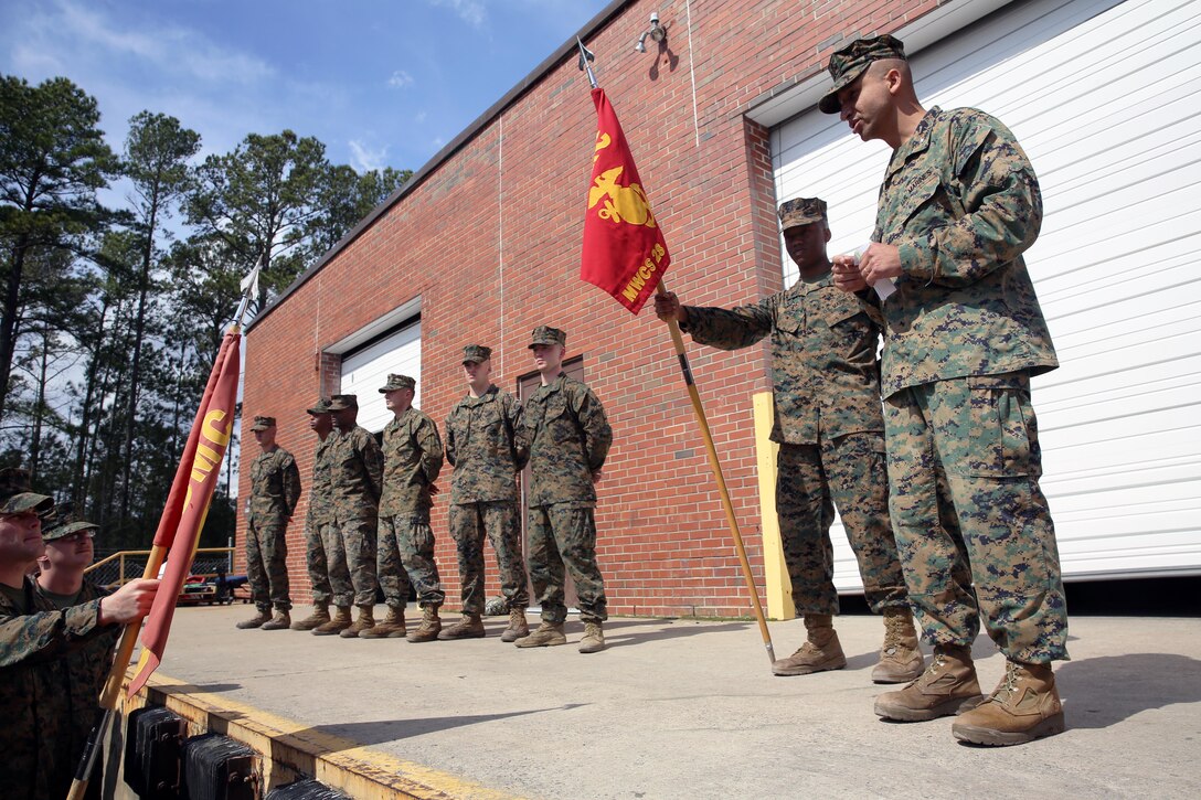 Lt. Col. Jaime Macias, right, addresses the Marines of Marine Wing Communication Squadron 28 following a 10-mile squadron conditioning hike as part of the Leonidas Awards competition at Marine Corps Air Station Cherry Point, N.C. March 5, 2015. The hike was the capstone event of the squadron’s biannual Leonidas Award competition, which pitted Marines from the squadron’s three companies against one another for a place in MWCS-28 history. The Leonidas Award serves to build camaraderie and esprit de corps within the noncommissioned officer and junior ranks of the squadron. Macias is the squadron’s commanding officer, and a native of Queens, N.Y.