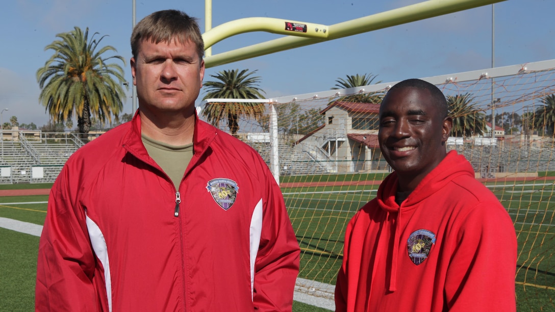 Gunnery Sgt. Gabriel Guest, a single leg amputee (Left), and Sgt. Michael Pride, an assistant coach for track (right), reunite after seven years at the 2015 Marine Corps Trials aboard Marine Corps Base Camp Pendleton, Calif., March 2015.