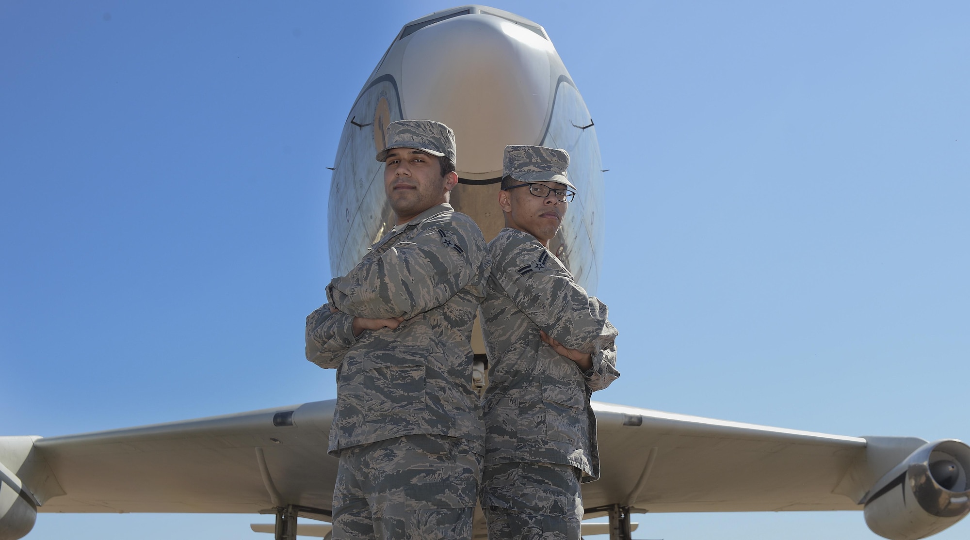 Airman 1st Class James Escobar (left) and Airman 1st Class Naxiel Nunez pose in front of a KC-135 Stratotanker March 11, 2015, on McConnell Air Force Base, Kan. Escobar and Nunez responded to a car crash outside McConnell AFB Feb. 28, 2015, helping save the victim’s life. Escobar is a 22nd Comptroller Squadron financial management technician and Nunez is a 22nd Medical Support Squadron outpatient records technician. (U.S. Air Force photo/Senior Airman Colby L. Hardin)