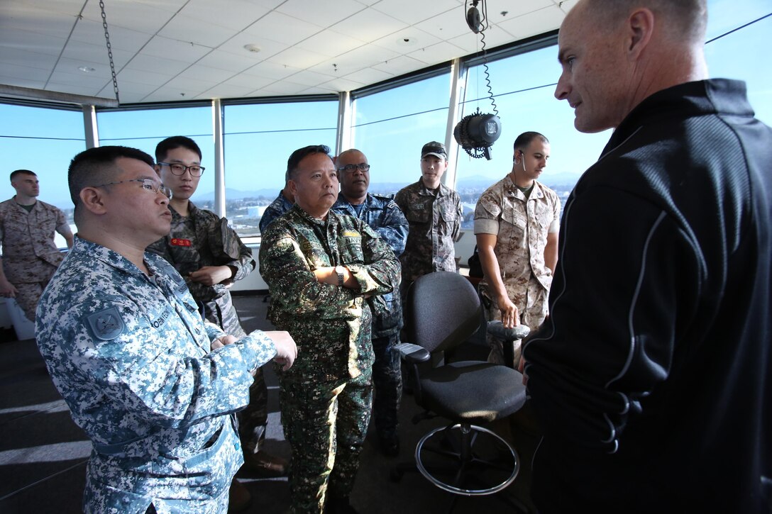 Marine Corps Air Station Miramar senior air traffic controller instructor Mike Setnan, answers questions from international officers during the 58th annual International Senior Officer Amphibious Planning Course, which featured Marine Corps Air Station Miramar, Calif., March 10.