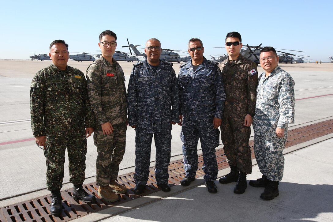 Officers from Bahrain, Philippines, Singapore and South Korea pose for a photo aboard Marine Corps Air Station Miramar, Calif., March 10. The officers toured the base as part of the 58th annual International Senior Officer Amphibious Planning Course.