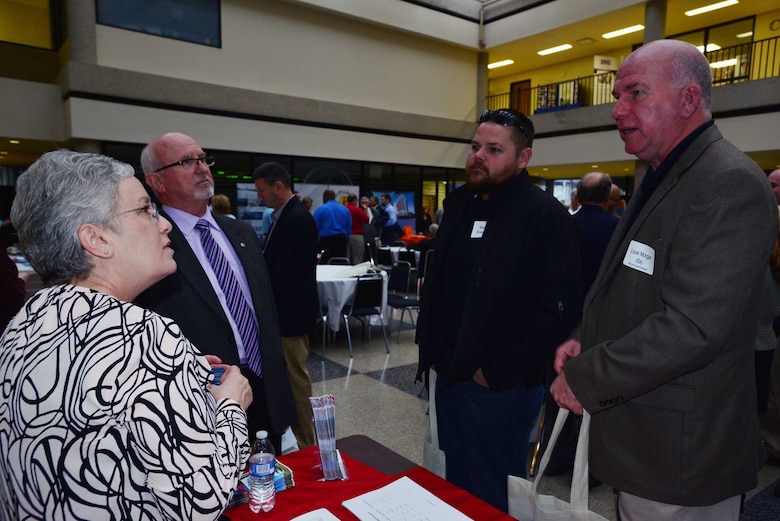 (Left to Right) Jacque Gee, deputy for Small Business at the U.S. Army Corps of Engineers Louisville District Business Office, Roy Rossignol, chief of the U.S. Army Corps of Engineers Nashville District Business Office and talk with Braxton Broeson and Louis Morgan at a Small Business Forum March 11, 2015, at the Tennessee State University Avon Williams Campus in Nashville, Tenn.