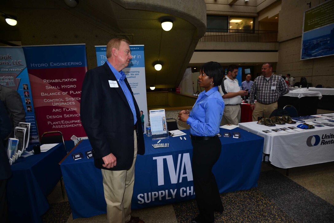 Althea Jones, supply chain senior program manager, Tennessee Valley Authority in Chattanooga, Tenn., talks with Wayne Palmer a business leader during the Small Business Forum, March11, 2015, at the Tennessee State University Avon Williams Campus in Nashville, Tenn.