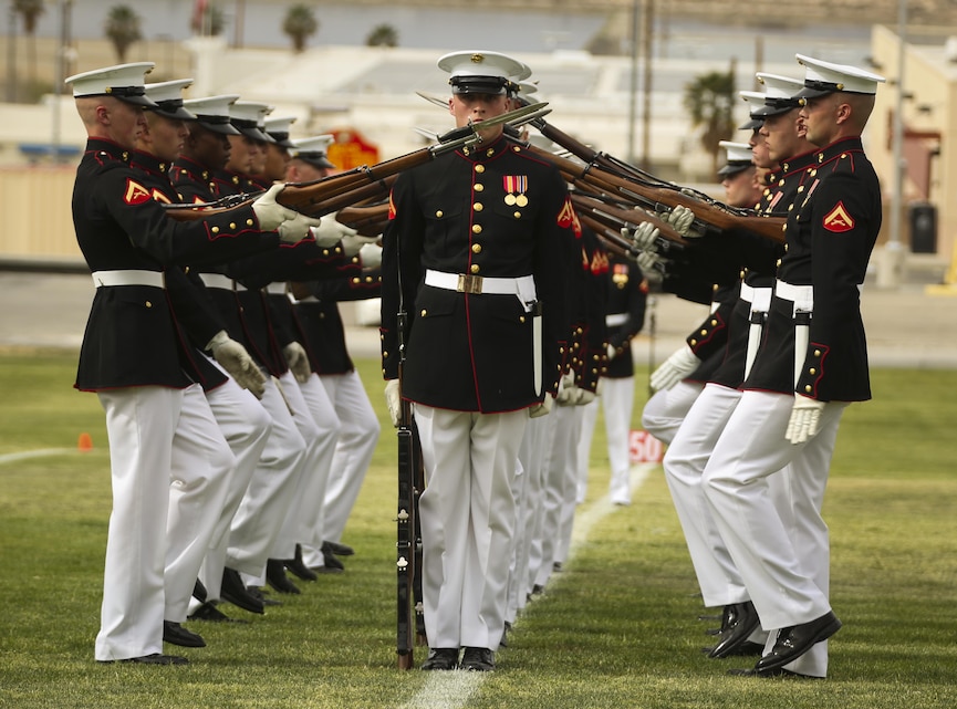 The Silent Drill Platoon performs a movement, extending the muzzles of their rifles with attached bayonets, for hundreds of Combat Center patrons during their performance at Lance Cpl. Torrey L. Gray Field, March 11, 2015.(Official Marine Corps Photo by Cpl. Charles Santamaria/Released)