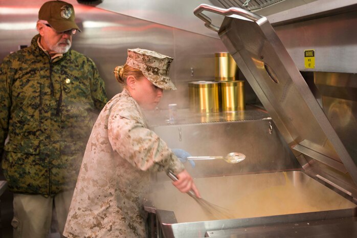 Lance Cpl. Maria Earll, a food Service specialist with Headquarters and Headquarters Squadron, prepares a portion of the meal slated to be served during the Maj. Gen. William Pendleton Thompson Hill Memorial Awards Program for Food Service Excellence, inside a temporary field mess aboard Marine Corps Air Station Iwakuni, Japan, March 9, 2015. The III Marine Expeditionary Force selected food service specialists aboard station to represent them in the W.P.T. Hill Awards in order to earn the title of the best field mess in the Marine Corps.