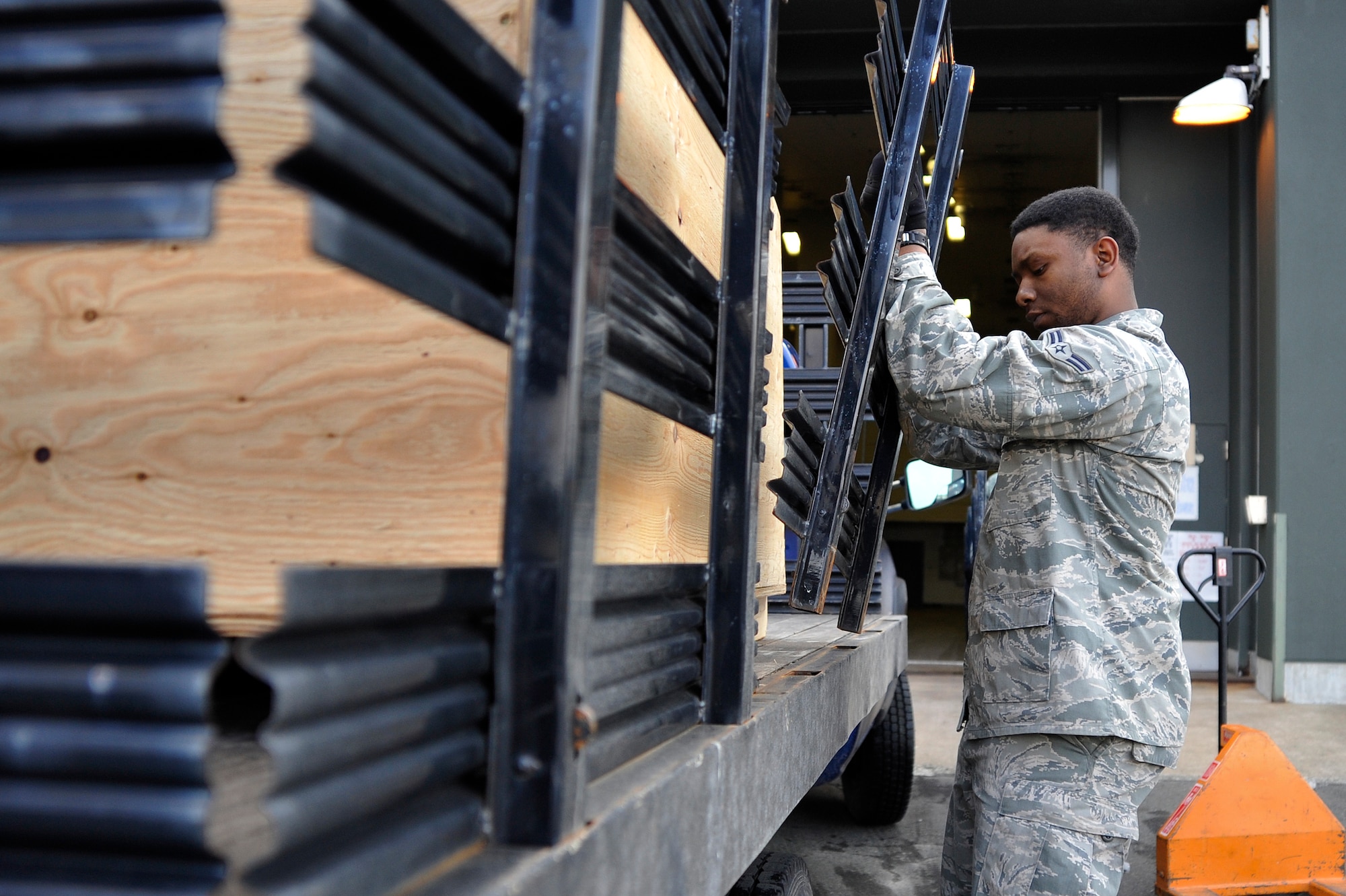 U.S. Air Force Airman 1st Class Elijah Rasheed, 35th Logistics Readiness Squadron materiel management journeyman, assists a customer in loading a crate onto a vehicle transport at Misawa Air Base, Japan, Feb. 10, 2015. Rasheed uses the values of responsibility he learned at a young age in his job on a daily basis to support the 35th Fighter Wing’s mission of peace and stability in the Asia-Pacific region. (U.S. Air Force photo by Senior Airman Jose L. Hernandez-Domitilo/Released)
