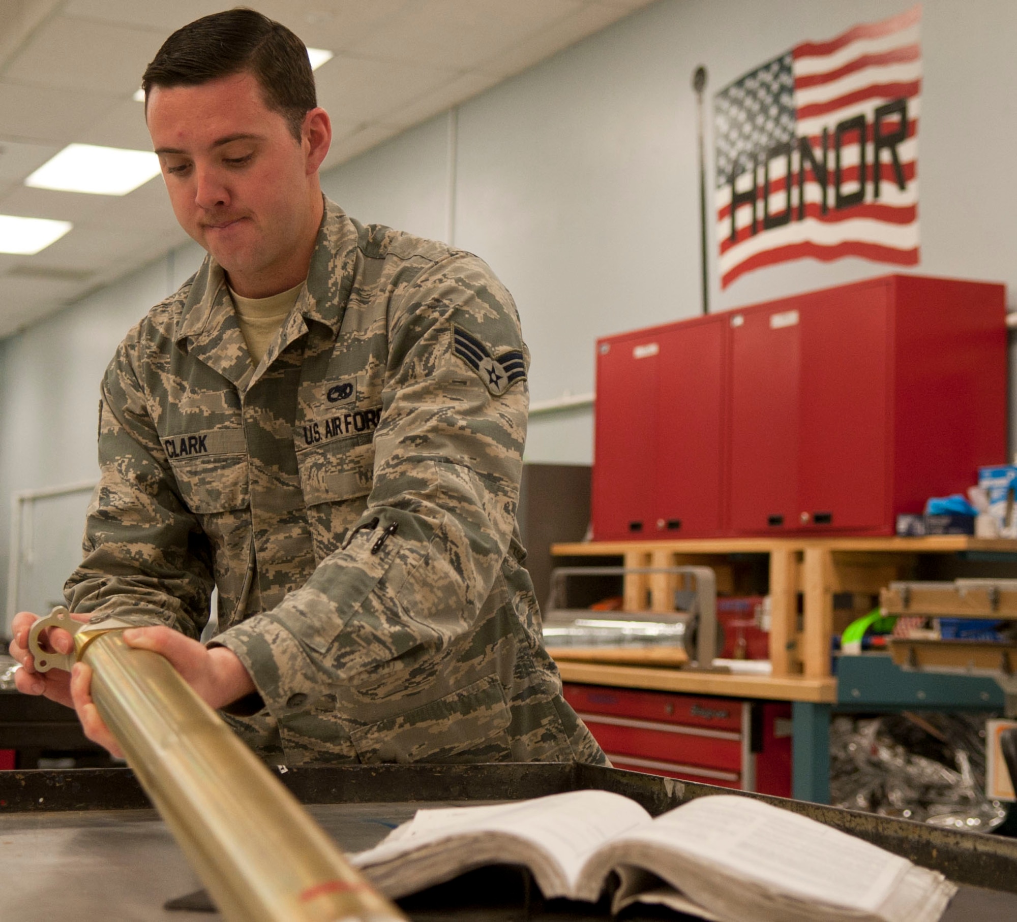 Senior Airman Peter Clark, 57th Maintenance Squadron munitions inspector, performs an egress inspection at the munitions inspection shop on Nellis Air Force Base, Nev., March 10, 2015. An egress inspection is performed on the rocket catapult, or ejection seat parts. (U.S. Air Force photo by Airman 1st Class Mikaley Towle)