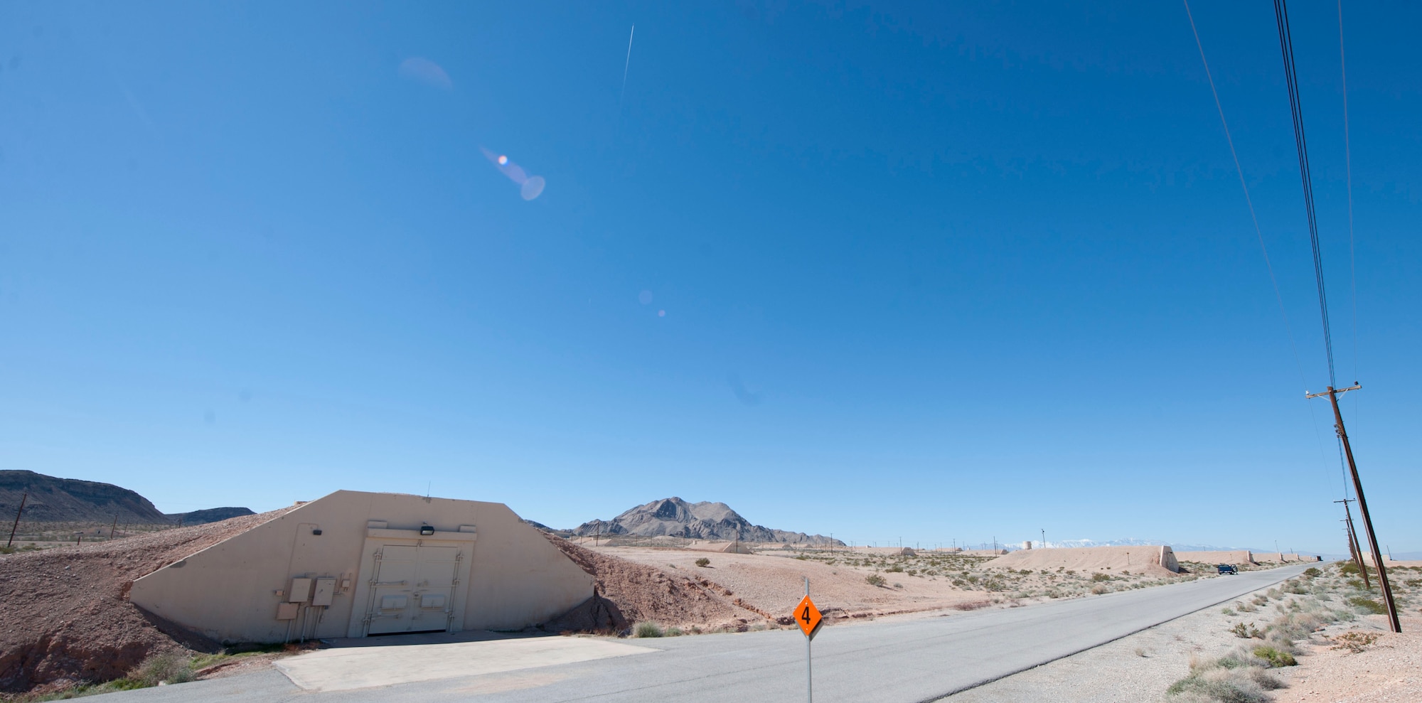 Munitions sit in igloos under 24 inches of dirt at the munitions storage area on Nellis Air Force Base, Nev., March 5, 2015. There are approximately 111 igloos at the munitions storage area. (U.S. Air Force photo by Airman 1st Class Mikaley Towle)