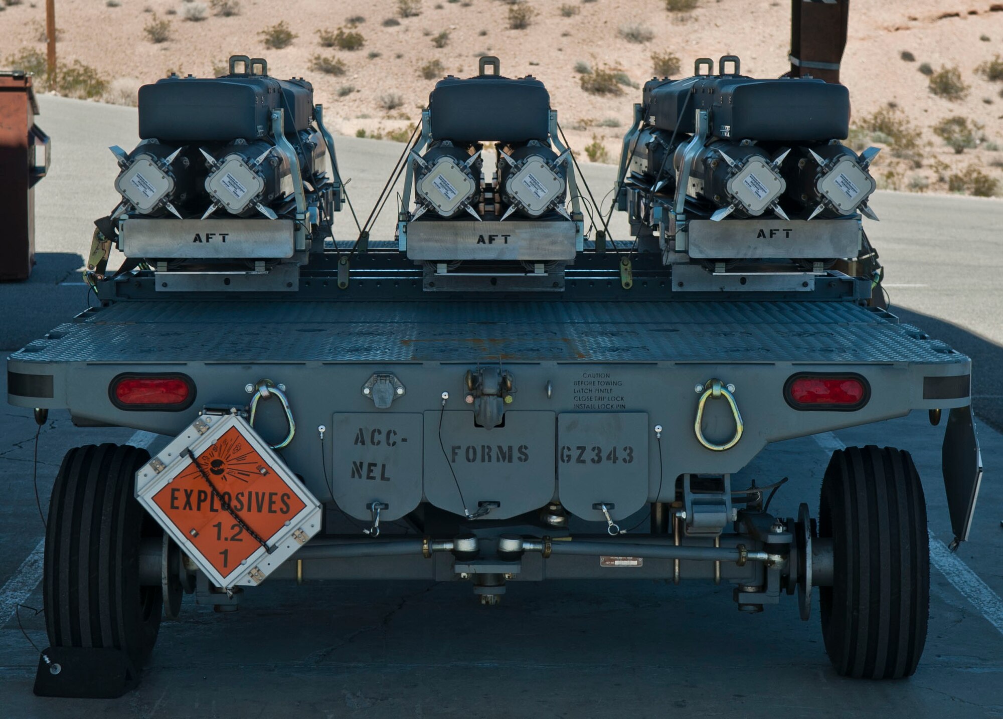 Munitions ready to be taken to the flightline sit on a trailer, or mod, at the munitions storage area at Nellis Air Force Base, Nev., March 5, 2015. Munitions need to be received, processed and prepared before they can be attached to the aircraft.  (U.S. Air Force photo by airman 1st Class Mikaley Towle)