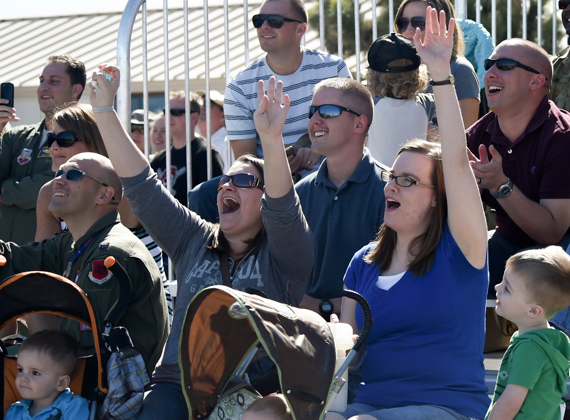 Local residents cheer the U.S. Air Force Air Demonstration Squadron Thunderbirds performance during Indian Springs Appreciation Day March 10, 2015, at Creech Air Force Base, Nevada. Held annual, the event is used to showcase the base’s mission and its Airmen, which helps build relationships with the Indian Springs populace. (U.S. Air Force photo by Tech. Sgt. Shad Eidson/released)