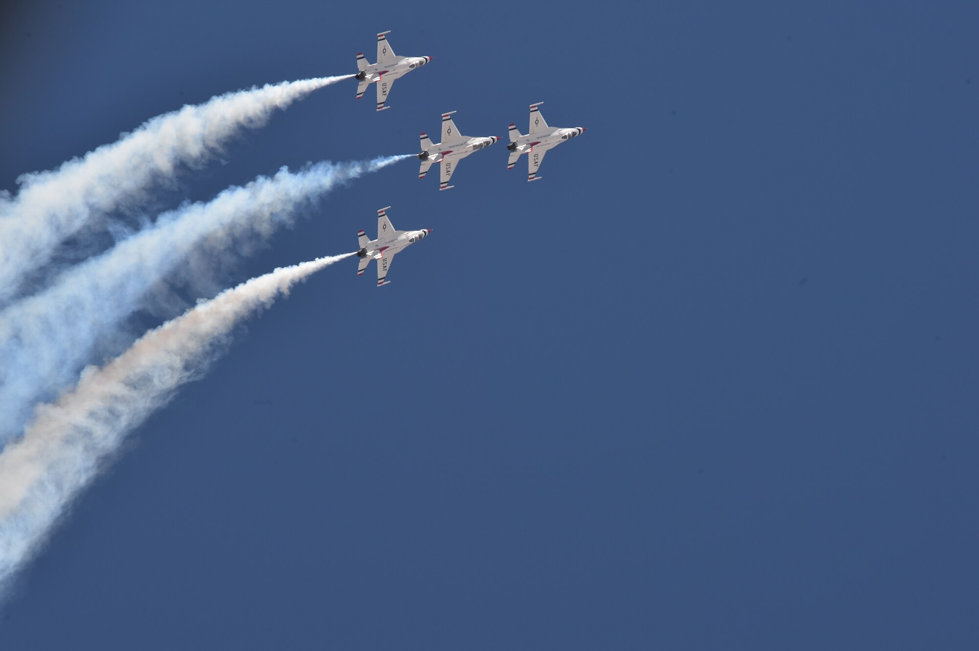 The U.S. Air Force Air Demonstration Squadron Thunderbirds perform an arrowhead loop during Indian Springs Appreciation Day March 10, 2015, at Creech Air Force Base, Nevada. Held annually, the event is used to showcase the base’s mission and the Airmen who makes it possible.  (U.S. Air Force photo by Senior Airman Adarius Petty/Released)