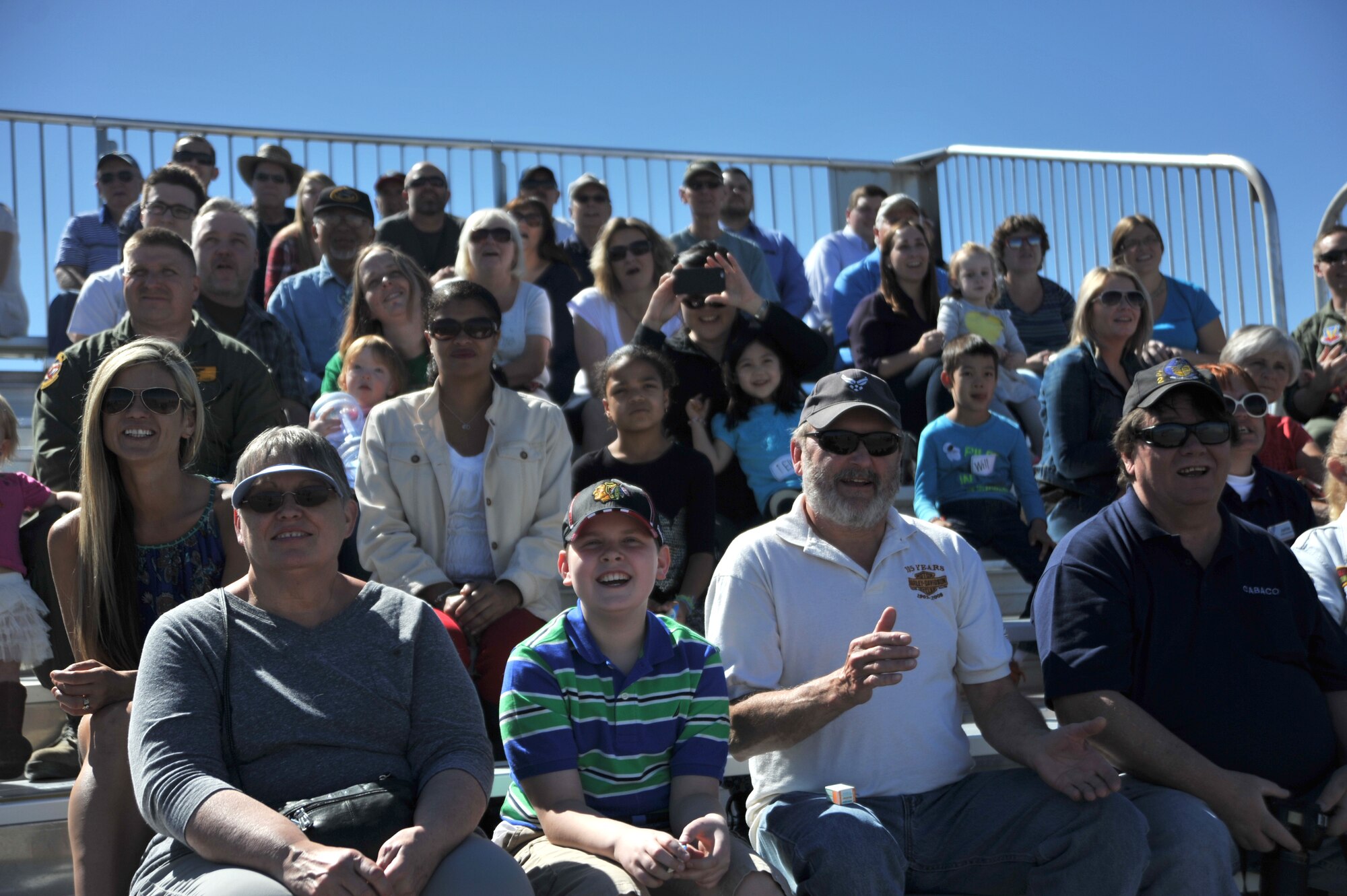 Indian Springs Appreciation Day spectators cheer during a performance by Las Vegas entertainer Jeff Civillico March 10, 2015 at Creech Air Force Base, Nevada. Civillico performed an interactive comedy act for the Indian Springs community and base members and their families. (U.S. Air Force photo by Airman 1st Class Christian Clausen/Released)