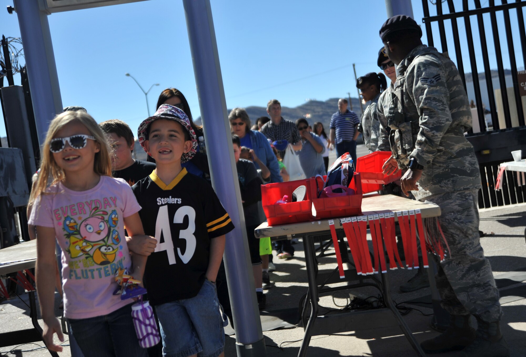 Indian Springs Elementary School students pass through a checkpoint for Indian Springs Appreciation Day March 10, 2015, at Creech Air Force Base, Nevada.  Students and members of the local community attended the annual event to learn about the various Creech AFB missions and the Airmen that complete them. (U.S. Air Force photo by Airman 1st Class Christian Clausen/Released)
