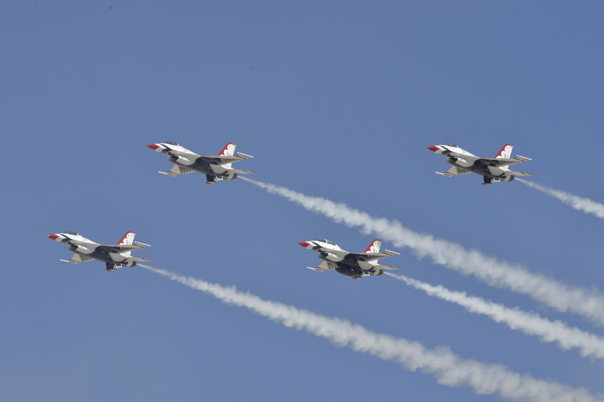 The U.S. Air Force Air Demonstration Squadron Thunderbirds perform their arrowhead loop routine during Indian Springs Appreciation Day March 10, 2015 at Creech Air Force Base, Nevada. The event is held annually to strengthen relationships between the local populace and the Airmen assigned to Creech.  (U.S. Air Force photo by Tech Sgt. Nadine Barclay/Released)