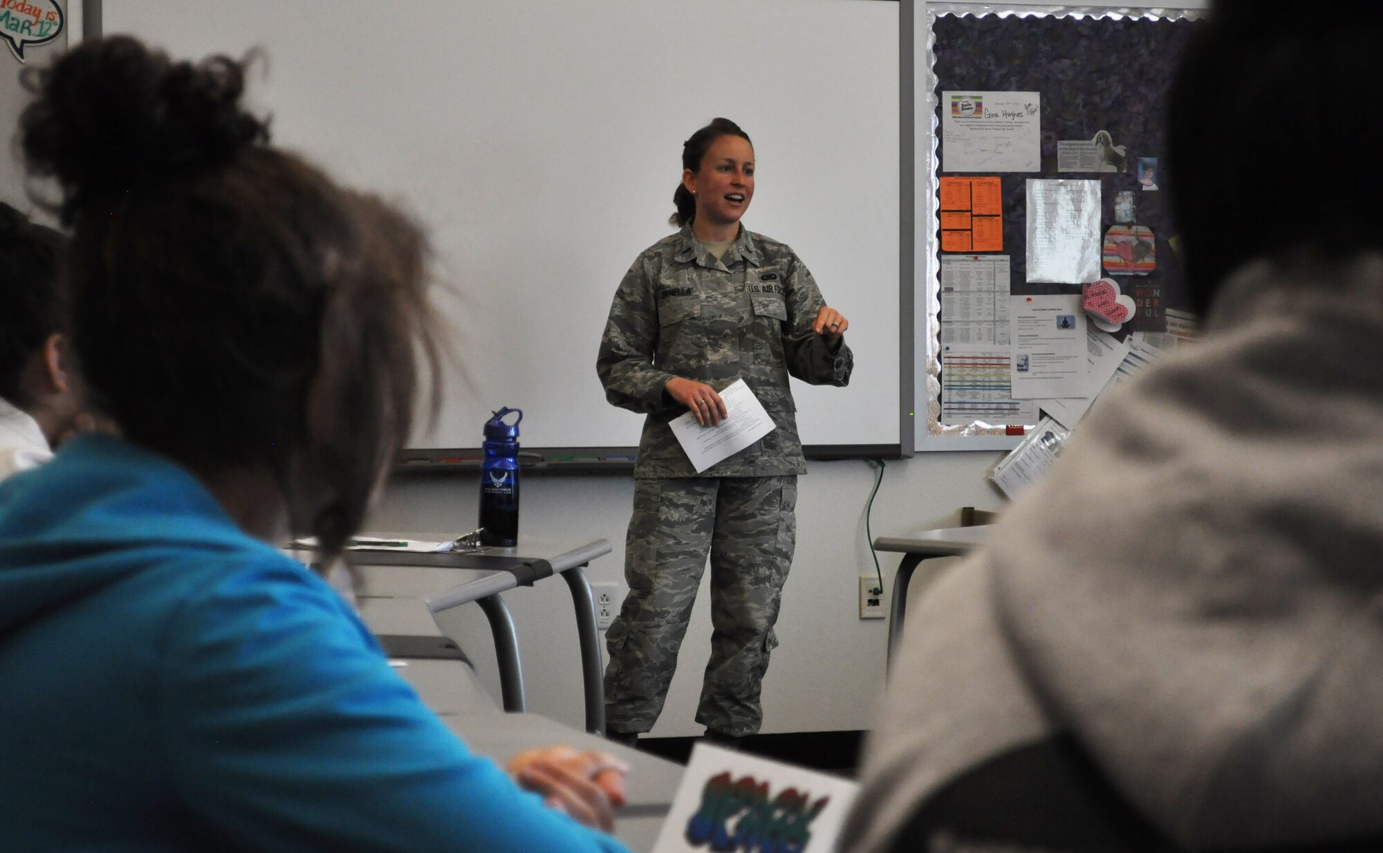 First Lt. Christen Ornella, 90th Missile Wing Public Affairs deputy chief, speaks with Triumph High School's female students about the military and her public affairs career, March 12, 2015, Cheyenne, Wyo. Ornella participated in the school's SPARK-Seek, Plan, Aspire, Reach and Kick A-program, spearheaded by Justice Kate Fox. About 80 students learned about various career opportunities that they may be interested in pursuing in the future, while Triumph's male students took a field trip just down the street to Laramie County Community College. This year marks the program's kickoff and is intended to be the pilot for a district-wide program for future years. (U.S. Air Force photo by 2nd Lt. Veronica Perez)