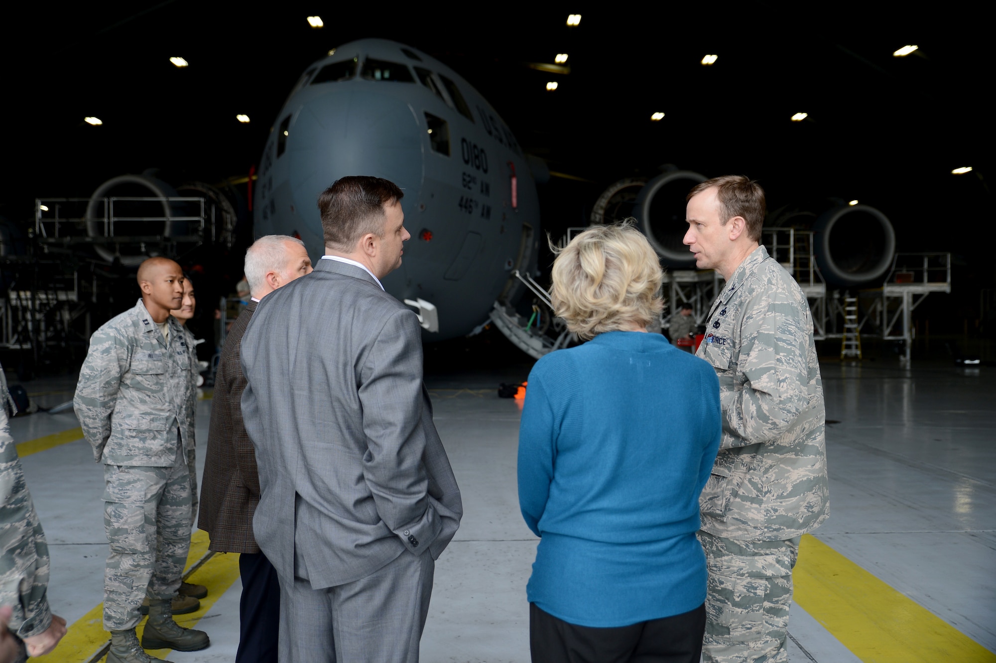 Col. Craig Gaddis (right), 62nd Maintenance Group commander, speaks to representatives from the United Parcel Services March 10, 2015, during a base tour at Joint Base Lewis-McChord, Wash. The representatives visited various work centers to meet with service members in their environments and to see some of their daily tasks. (U.S. Air Force photo/Airman 1st Class Keoni Chavarria)