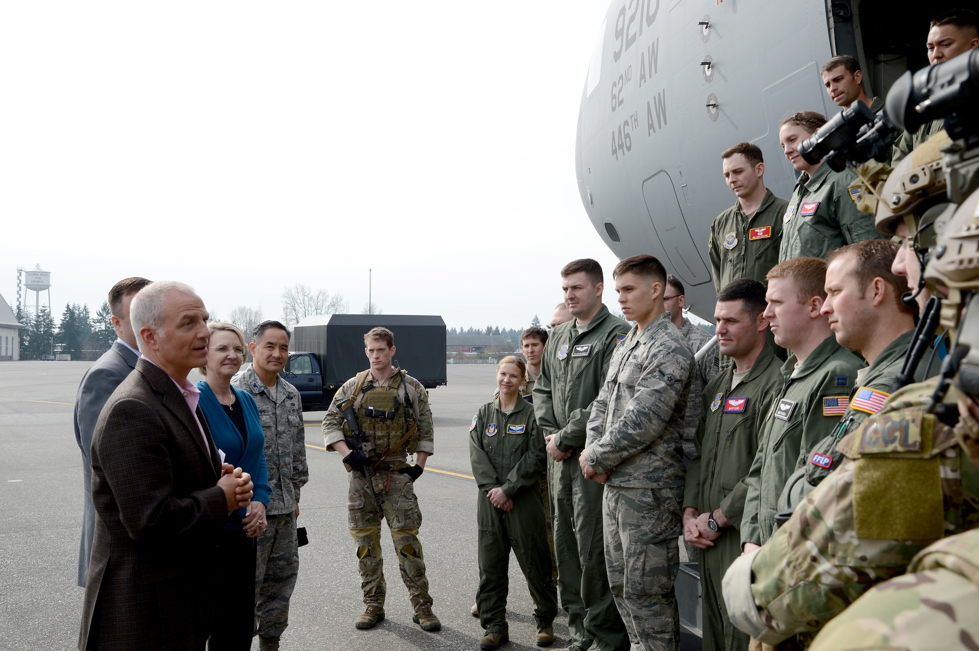 Chris Peck (left), United Parcel Service vice president of human resources, extends his appreciation to Airmen March 10, 2015, during a base tour at Joint Base Lewis-McChord, Wash. The tour highlighted service members to establish a relationship for UPS’s Apprenticeship Program for transitioning JBLM service members. (U.S. Air Force photo/Airman 1st Class Keoni Chavarria)