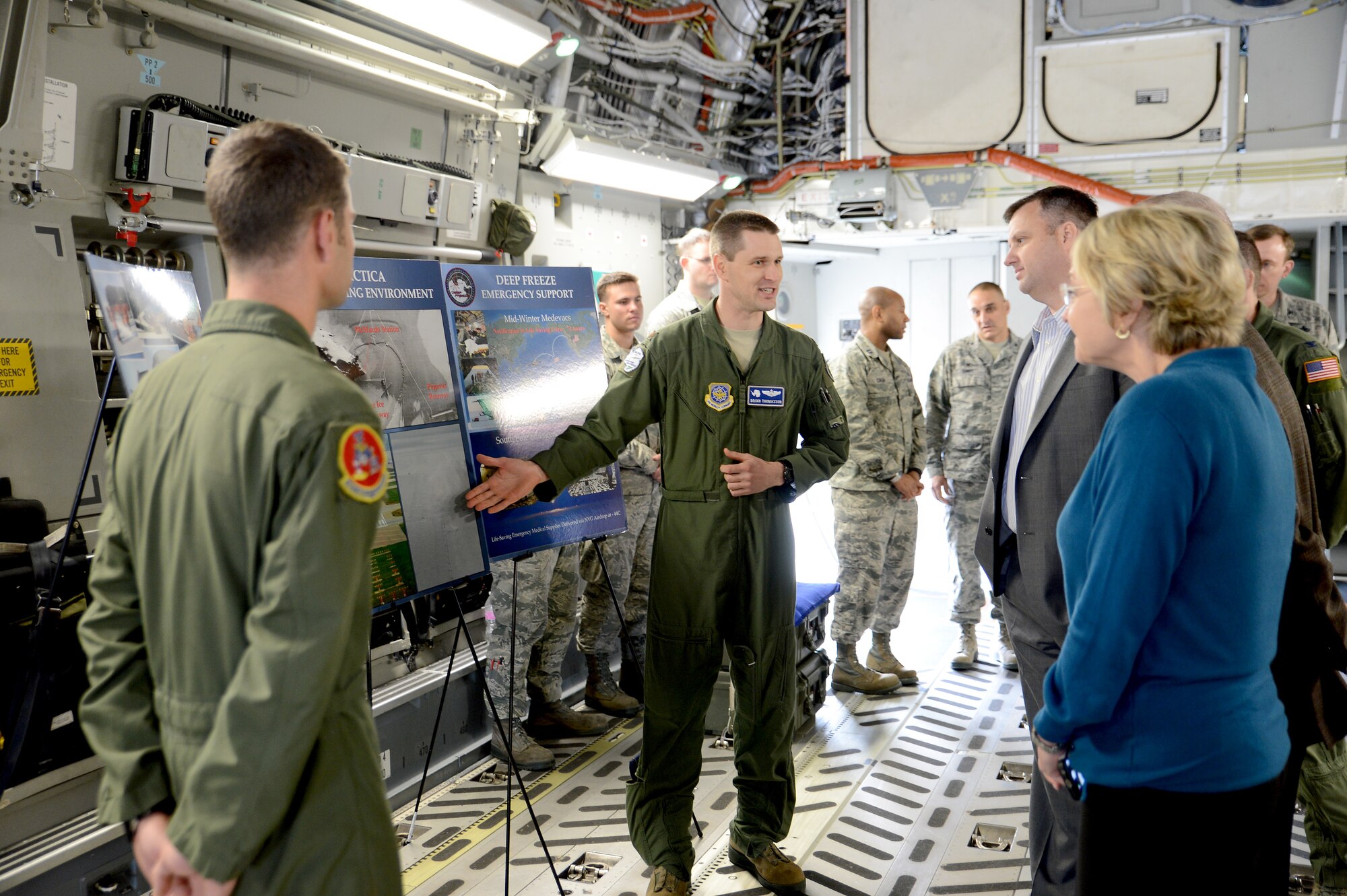 Maj. Brain Thomasson (center), 62nd Airlift Wing executive officer, explains Operation DEEP FREEZE to United Parcel Service representatives March 10, 2015, during a base tour at Joint Base Lewis-McChord, Wash. Operation DEEP FREEZE was one of several missions briefed to the UPS representatives, along with the 446th Aeromedical Evacuation Squadron’s and the 22nd Special Tactics Squadron’s missions. (U.S. Air Force photo/Airman 1st Class Keoni Chavarria)
