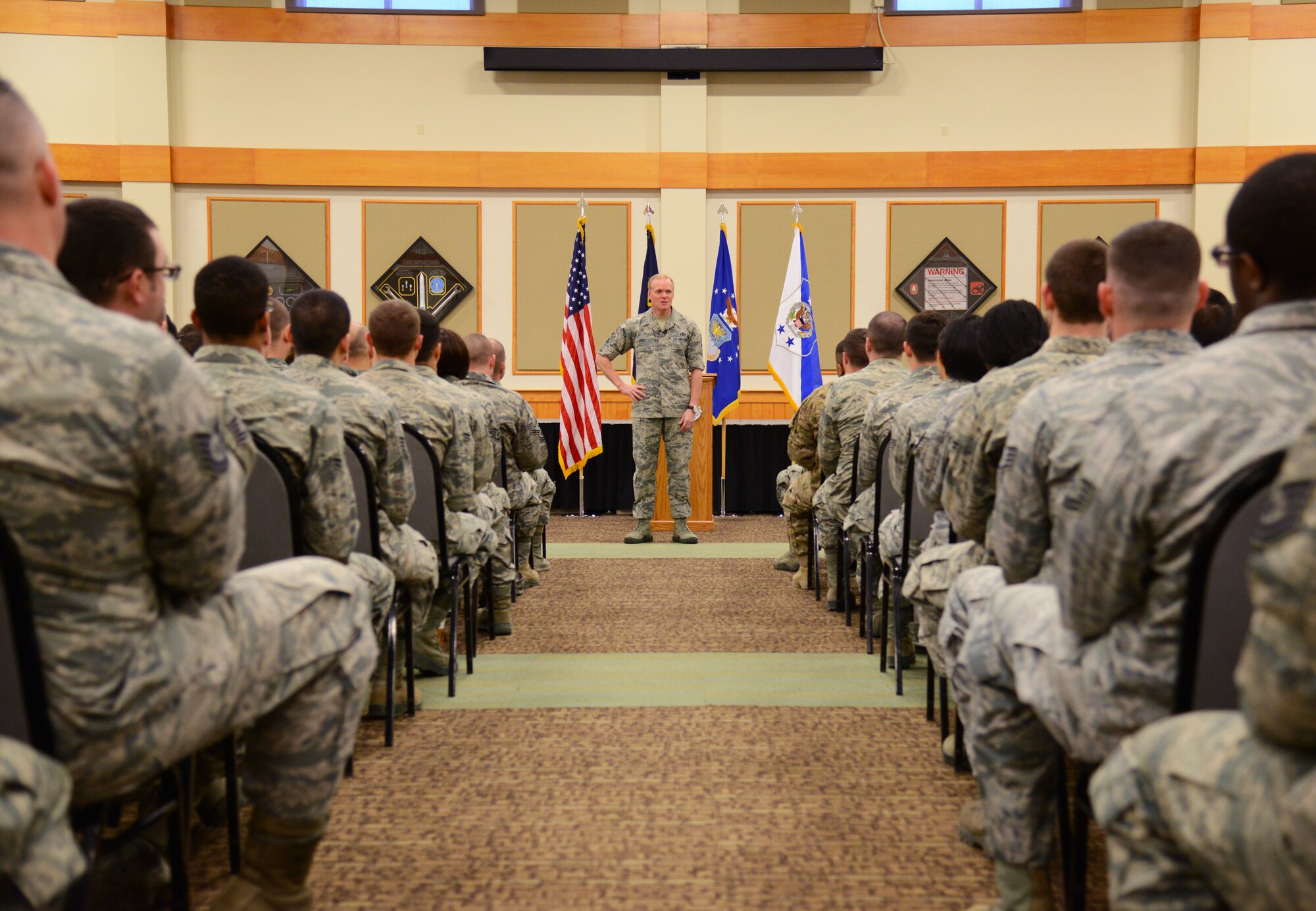 Chief Master Sgt. of the Air Force James Cody speaks to Airmen from Malmstrom Air Force Base, Mont., March 10. During the all call, Cody spoke on where he believed the Air Force will be heading in coming years and the programs that will soon be implemented to bring a better quality of life to Airmen currently serving. (U.S. Air Force photo/Airman 1st Class Dillon Johnston)