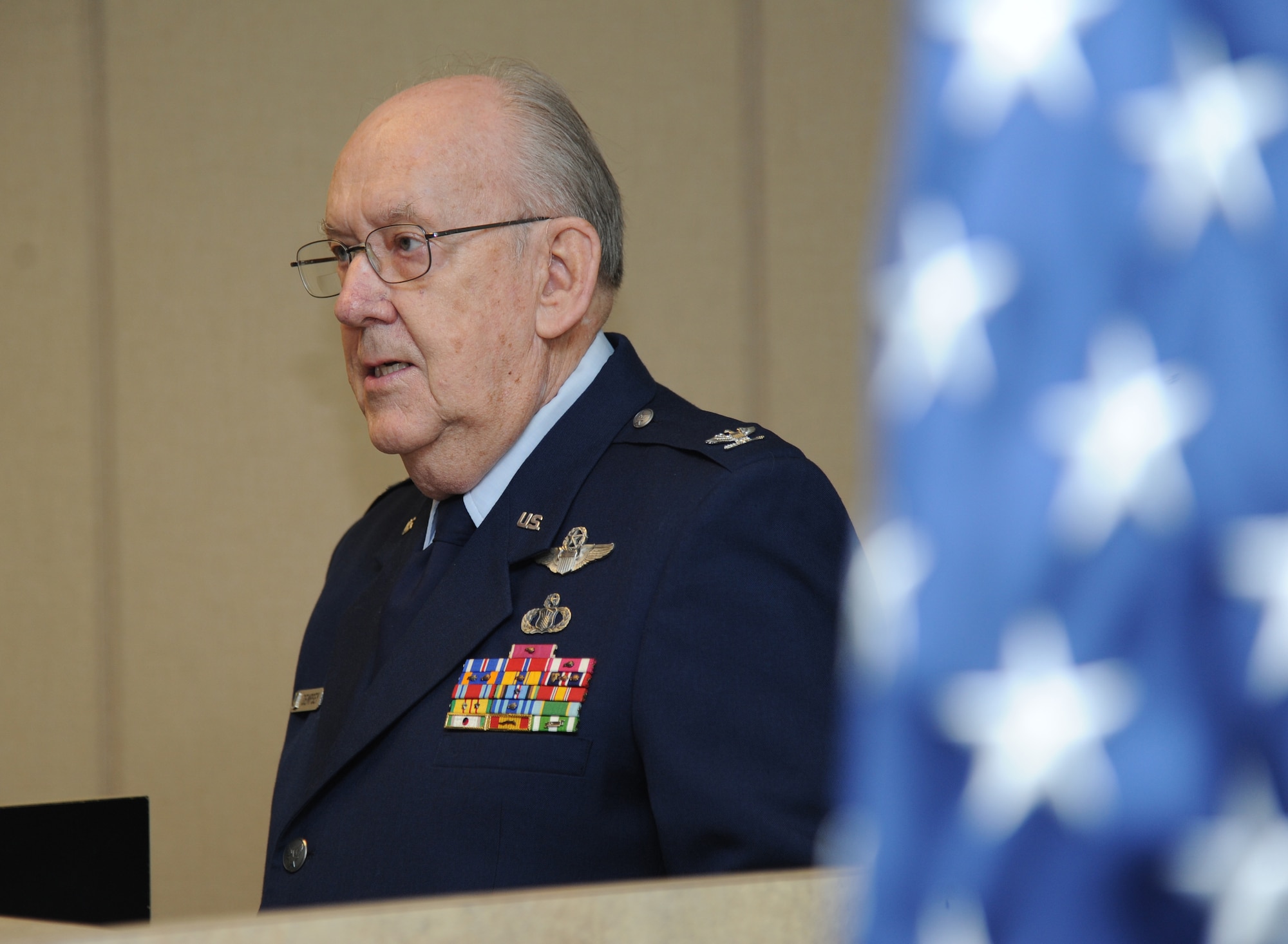 Retired Air Force Col. Derrel Dempsey speaks to attendees during a room dedication ceremony in his honor March 9, 2015, at Cody Hall, Keesler Air Force Base, Miss.  The 334th Training Squadron dedicated the building’s conference room in honor of Dempsey’s military accomplishments.  Dempsey, who’s recognized in the Air Force's Communications and Information Hall of Fame, has 30 years of Air Force aviation experience as chief of air traffic control, flight inspection pilot, radar approach control and control tower officer and air traffic control staff officer at various assignments around the world. The Air Force's award for the most outstanding air traffic control officer manager of the year is named in his honor.  (U.S. Air Force photo by Kemberly Groue)
