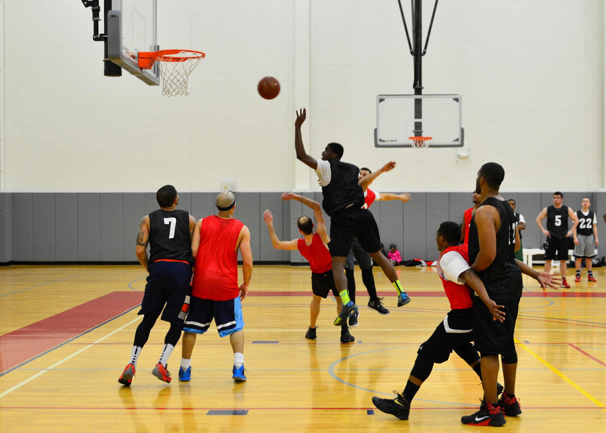 Domonic Townsend, 512th Airlift Wing small forward, shoots a floater March 10, 2015, during an intramural basketball game at the fitness center on Dover Air Force Base, Del. The 512th AW lost to the 436th Force Support Squadron in their last game of the regular season but progressed to the playoffs as the number three seed in the American League. (U.S. Air Force photo/Airman 1st Class William Johnson)