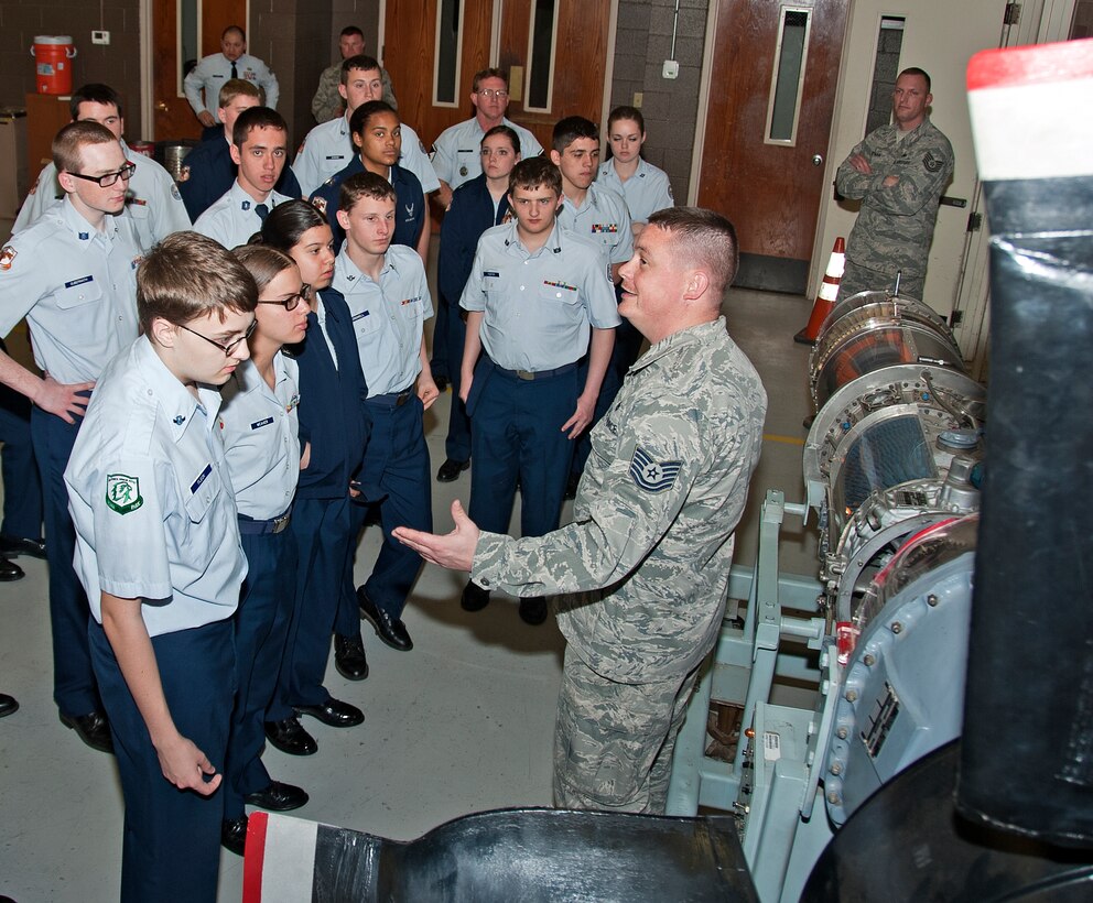 U.S. Air Force Tech. Sgt. Craig Wyman, 361st Training Squadron aerospace propulsion instructor, explains how the Air Force investigates different scenarios of damaged aircraft engines and explains what happened during an aircraft crash to the Burkburnett High School Air Force Junior ROTC cadets on Sheppard Air Force Base, Texas, March 11, 2015. The AFJROTC cadets are part of a base tour hosted by the Sheppard Air Force Base Public Affairs Department. (U.S. Air Force photo by Frank Carter/Released)