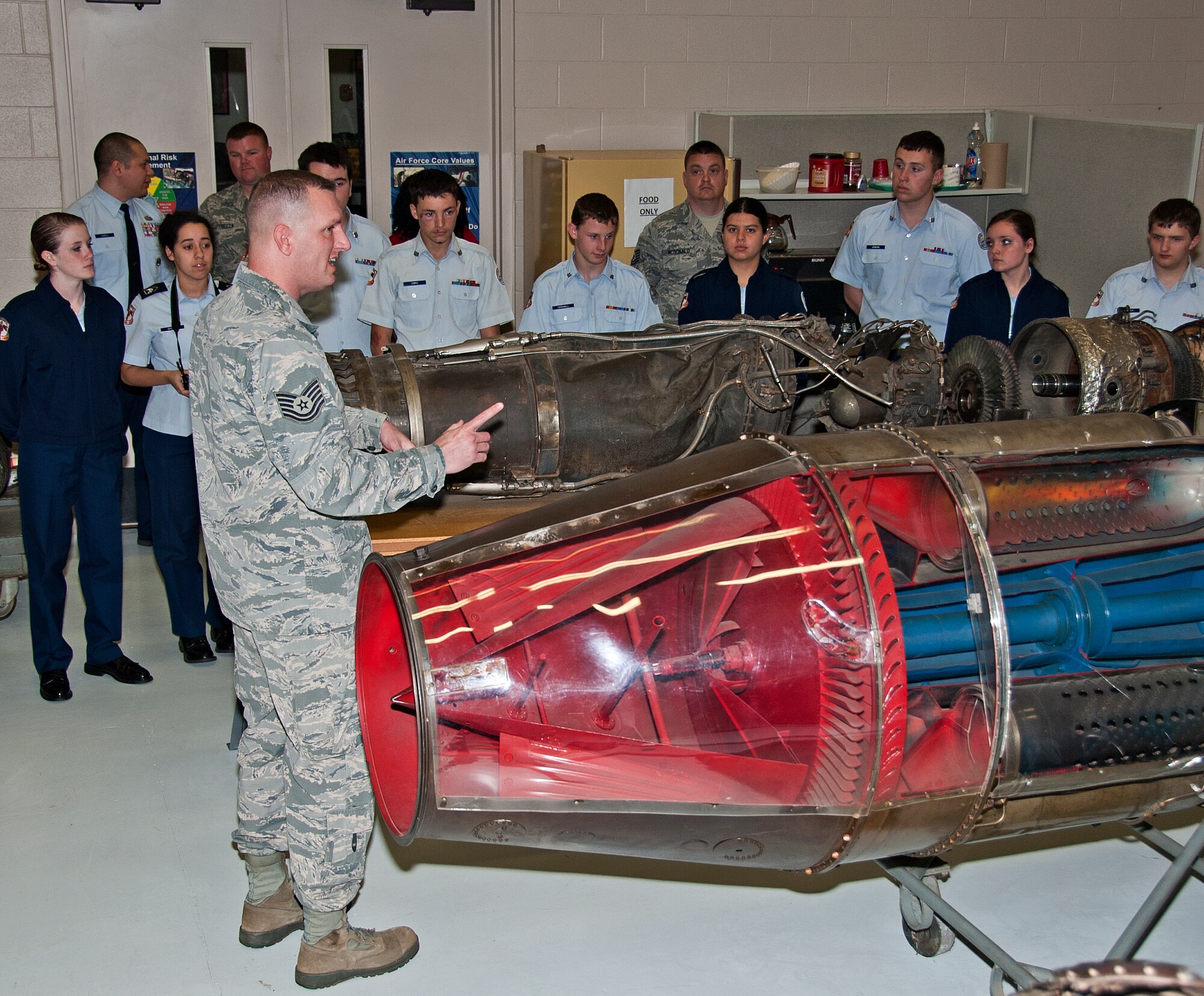 U.S. Air Force Tech. Sgt. Adam McDonald, 361st Training Squadron aerospace propulsion instructor, demonstrates a training model of a C-130 aircraft engine to the Burkburnett High School Air Force Junior ROTC cadets on Sheppard Air Force Base, Texas, March 11, 2015. The AFJROTC cadets are part of a base tour hosted by the Sheppard Air Force Base Public Affairs Department. (U.S. Air Force photo by Frank Carter/Released)