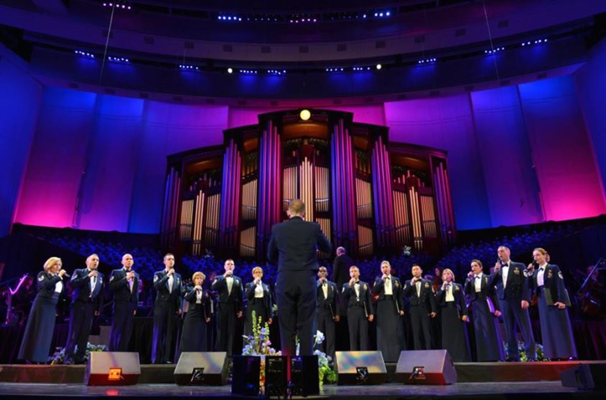 The Singing Sergeants, conducted by Capt. Joseph Hanson, were featured at the American Choral Directors Association national conference in Salt Lake City, on Feb. 28 at Temple Square. Later in the program, they joined the Mormon Tabernacle Choir and the Orchestra and more than 2,000 young choral musicians from around the country for a glorious mass choir performance before approximately 20,000 attendees. (U.S. Air Force photo by Senior Master Sgt. Bob Kamholz/released)