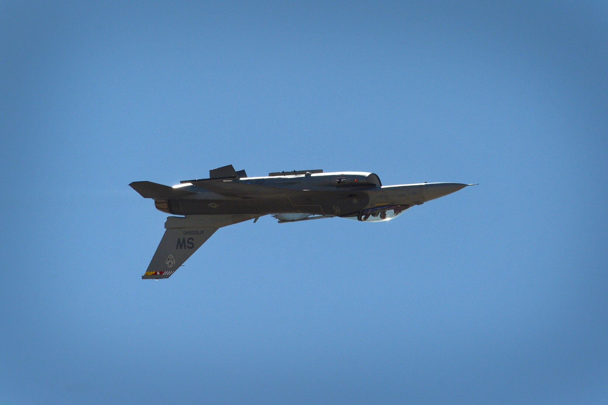 U.S. Air Force Capt. Craig Baker, F-16 Viper Demo Team pilot, flies inverted during the Heritage Flight Certification and Training Course at Davis-Monthan Air Force Base, Ariz., Feb. 27, 2015. During the four day course, Baker flew eight sorties, practicing his demonstration and learned to fly Heritage Flights with several HF aircraft. (U.S. Air Force photo by Senior Airman Jensen Stidham/Released) 