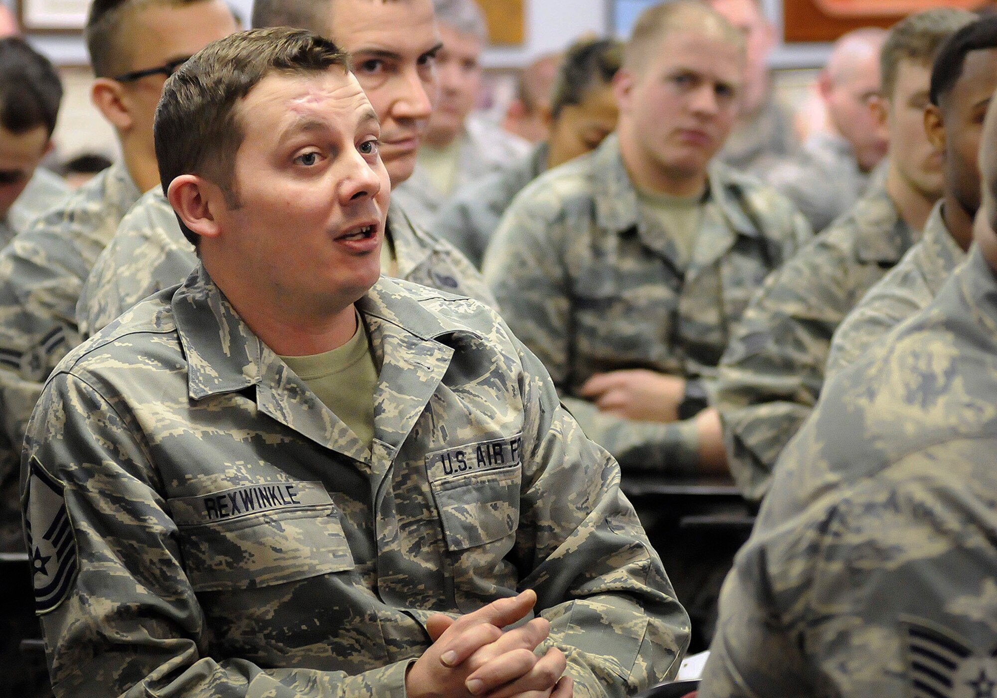 Master Sgt. Christopher Rexwinkle, 138th Civil Engineering Squadron, speaks to the 138th Fighter Wing commander and command chief during a wing commander's town hall meeting 7 March 2015, at the Tulsa Air National Guard base, Okla.   The command staff visited select units on the installation, and plan on rotating visitations throughout all the organizations during future UTA’s.  (U.S. National Guard photo by Tech. Sgt. Roberta A. Thompson/Released)