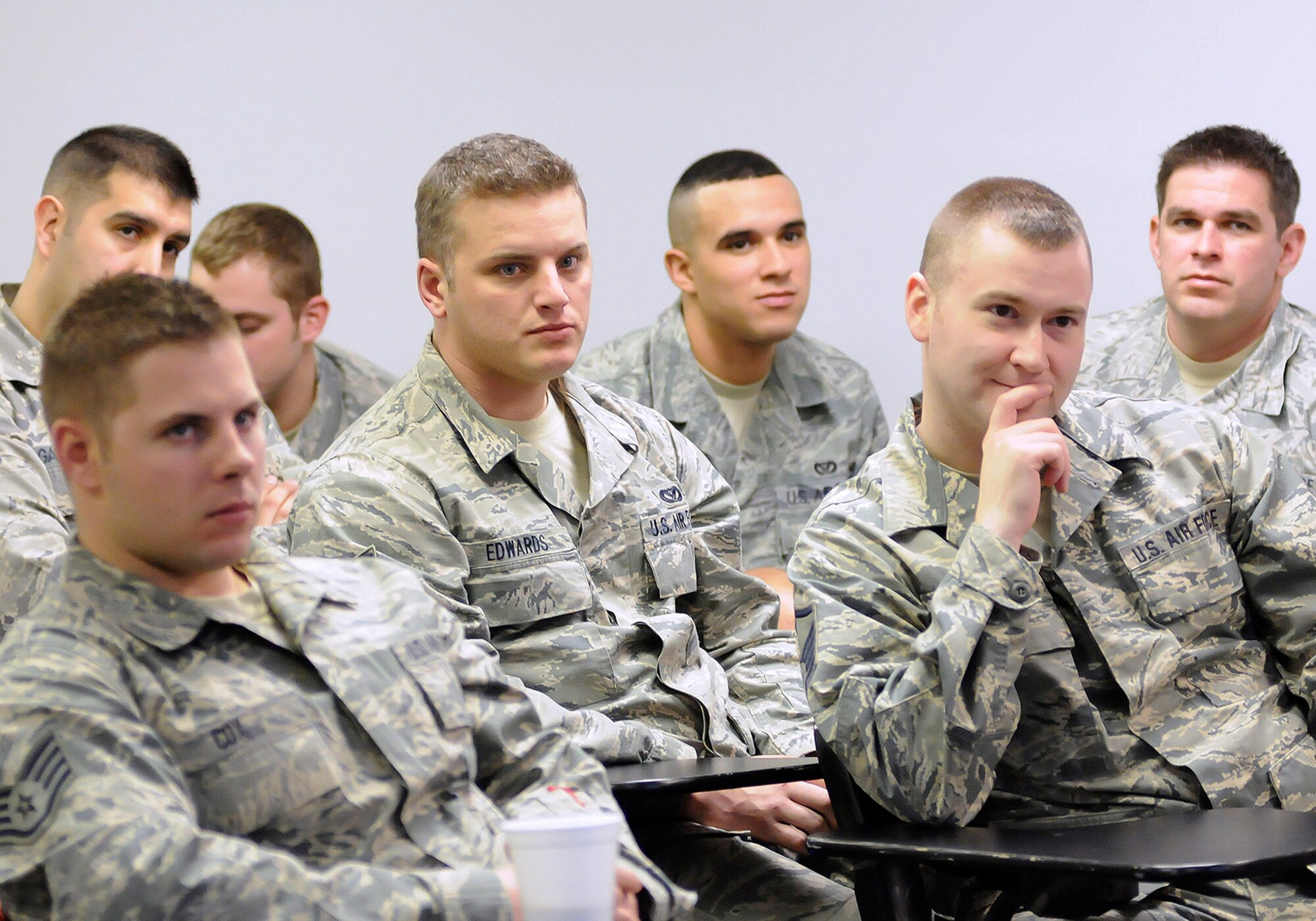 Members of the 138th Civil Engineering Squadron listen to the 138th Fighter Wing commander and command chief during a wing commander's town hall meeting 7 March 2015, at the Tulsa Air National Guard base, Okla.   The command staff visited select units on the installation, and plan on rotating visitations throughout all the organizations during future UTA’s.  (U.S. National Guard photo by Tech. Sgt. Roberta A. Thompson/Released)