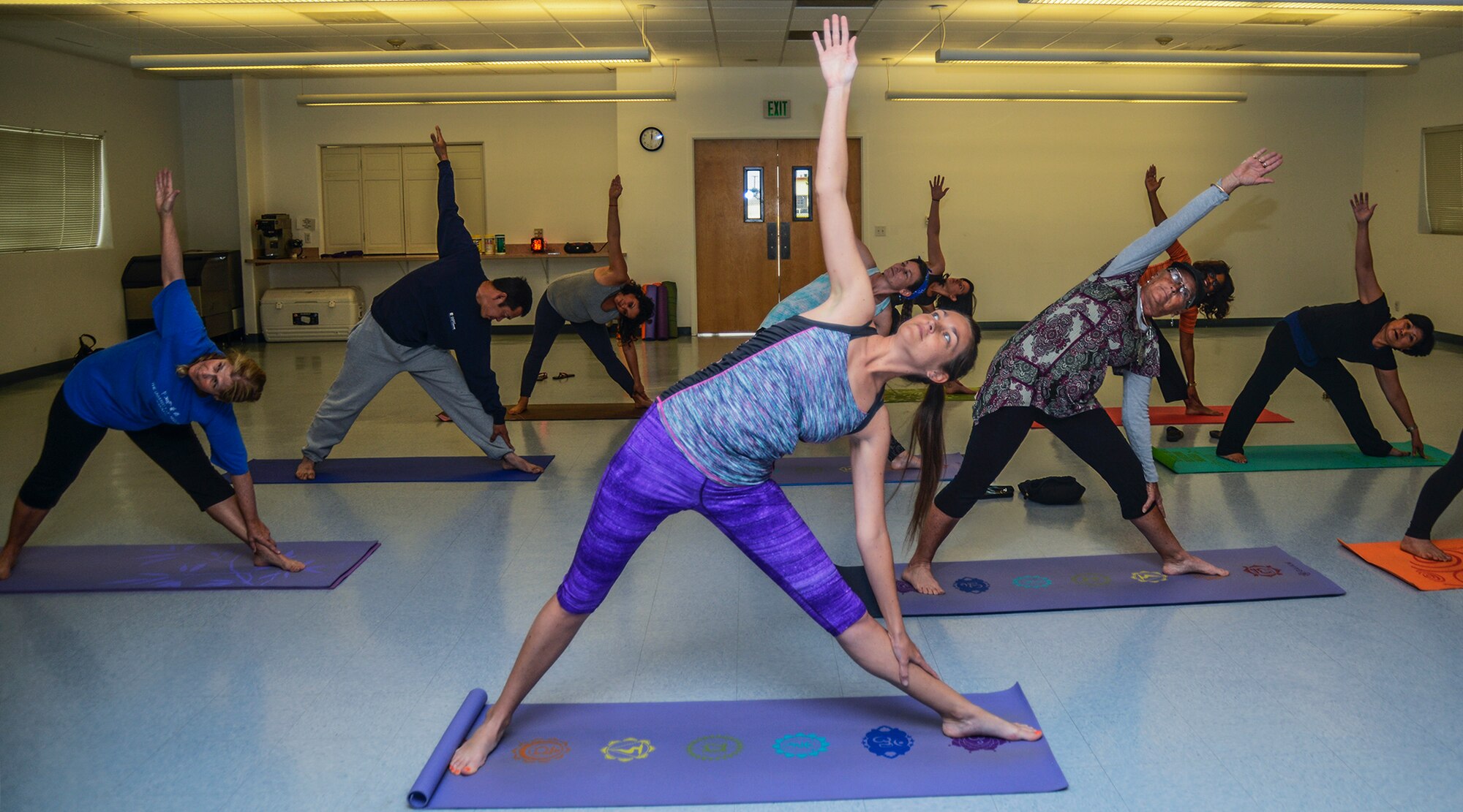 Yoga classes are offered in the Chapel 1 Annex to anyone with base access. Instructor Melissa Hoffman offers the classes to help her students relieve stress and build muscle. (U.S. Air Force photo by Rebecca Amber)