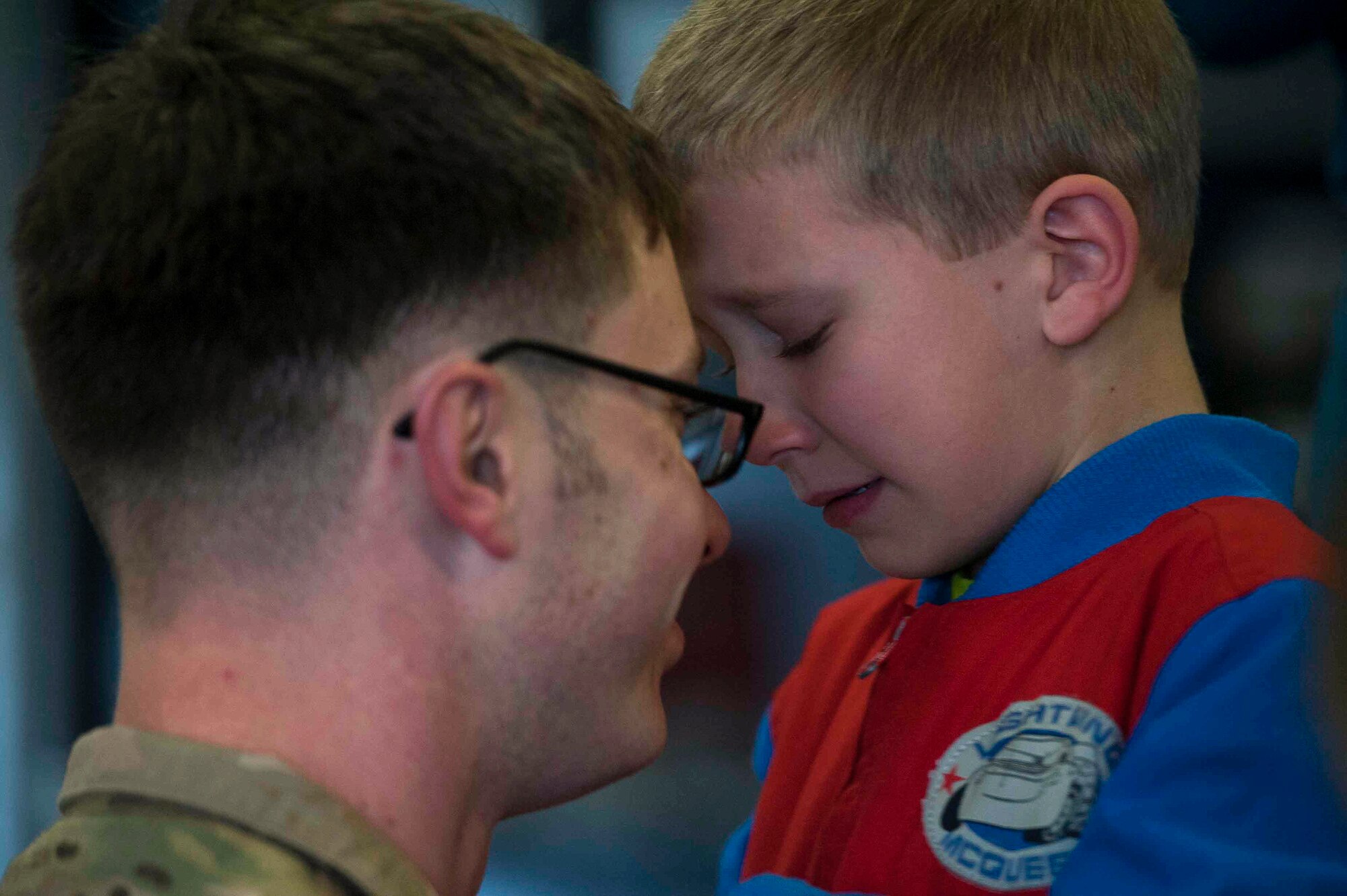 Tech. Sgt. William Aker, 19th Aircraft Maintenance Squadron crew chief, tells his son goodbye before deploying to Southwest Asia March 4, 2015, at Little Rock Air Force Base, Ark. Approximately 90 maintainers deployed to support the Combat Airlift mission downrange. (U.S. Air Force photo by Senior Airman Kaylee Clark)