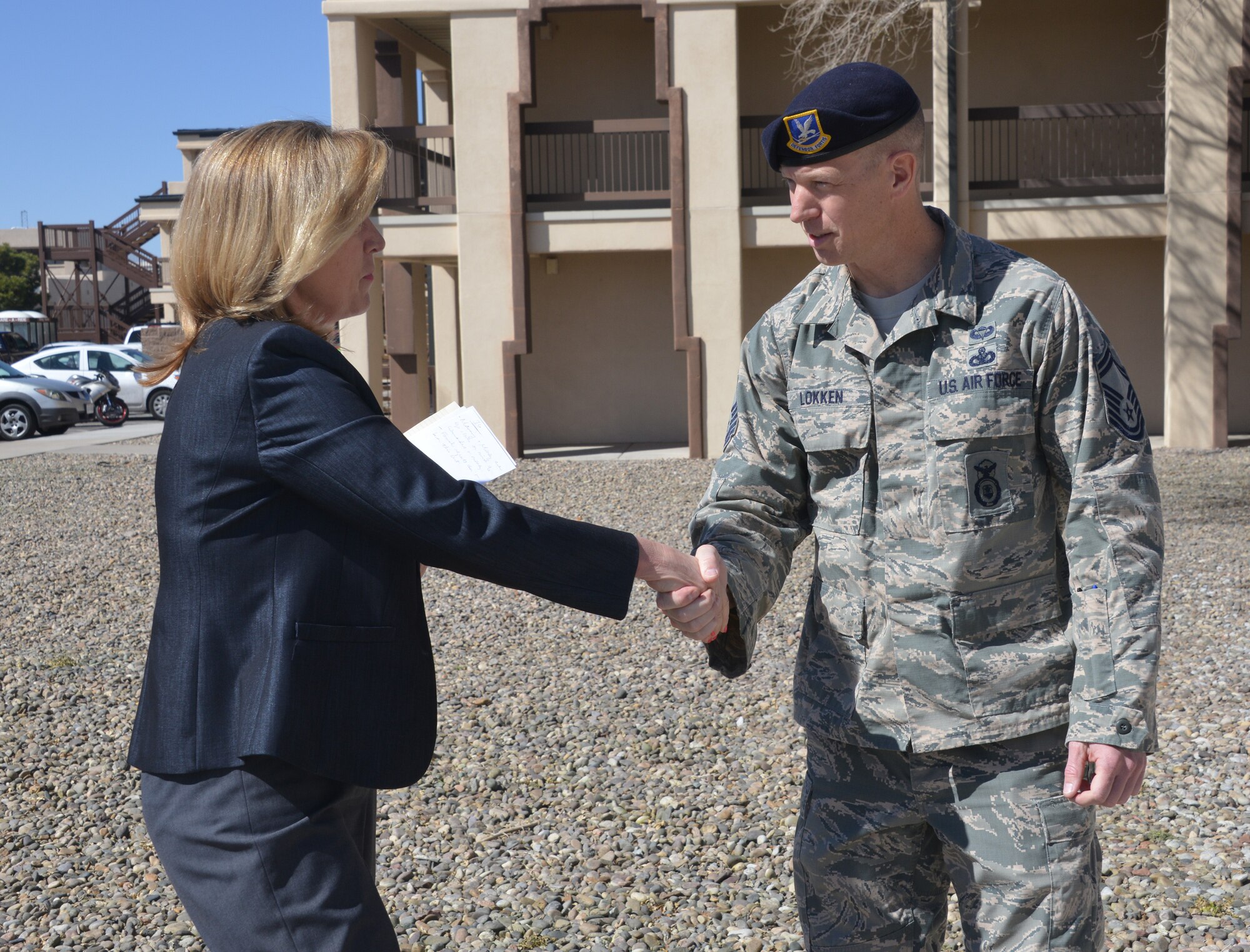 Secretary of the Air Force Deborah Lee James greets Senior Master Sgt. John Lokken, 377th Security Forces Squadron, during her visit to Kirtland March 10. James made speaking with Airmen informally throughout her visit a priority to learn about issues important to them. (Photo by Dennis Carlson)