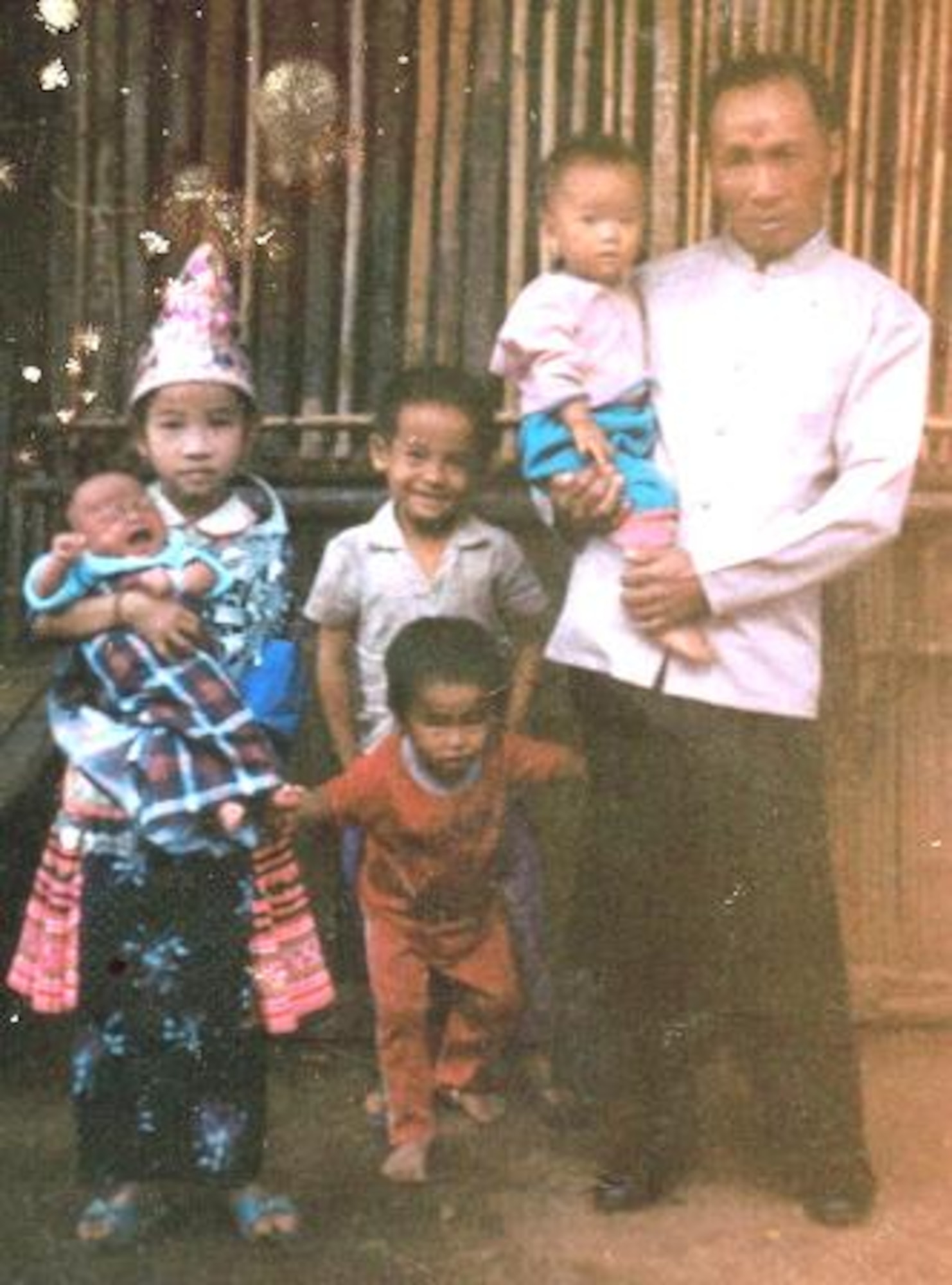 Senior Airman Yia Thao’s family poses for a photo upon their arrival to the Bamvinah refugee camp in Thailand, Sept. 1975. Thao’s family lived in the refugee camp for nearly 14 years. (Courtesy photo)