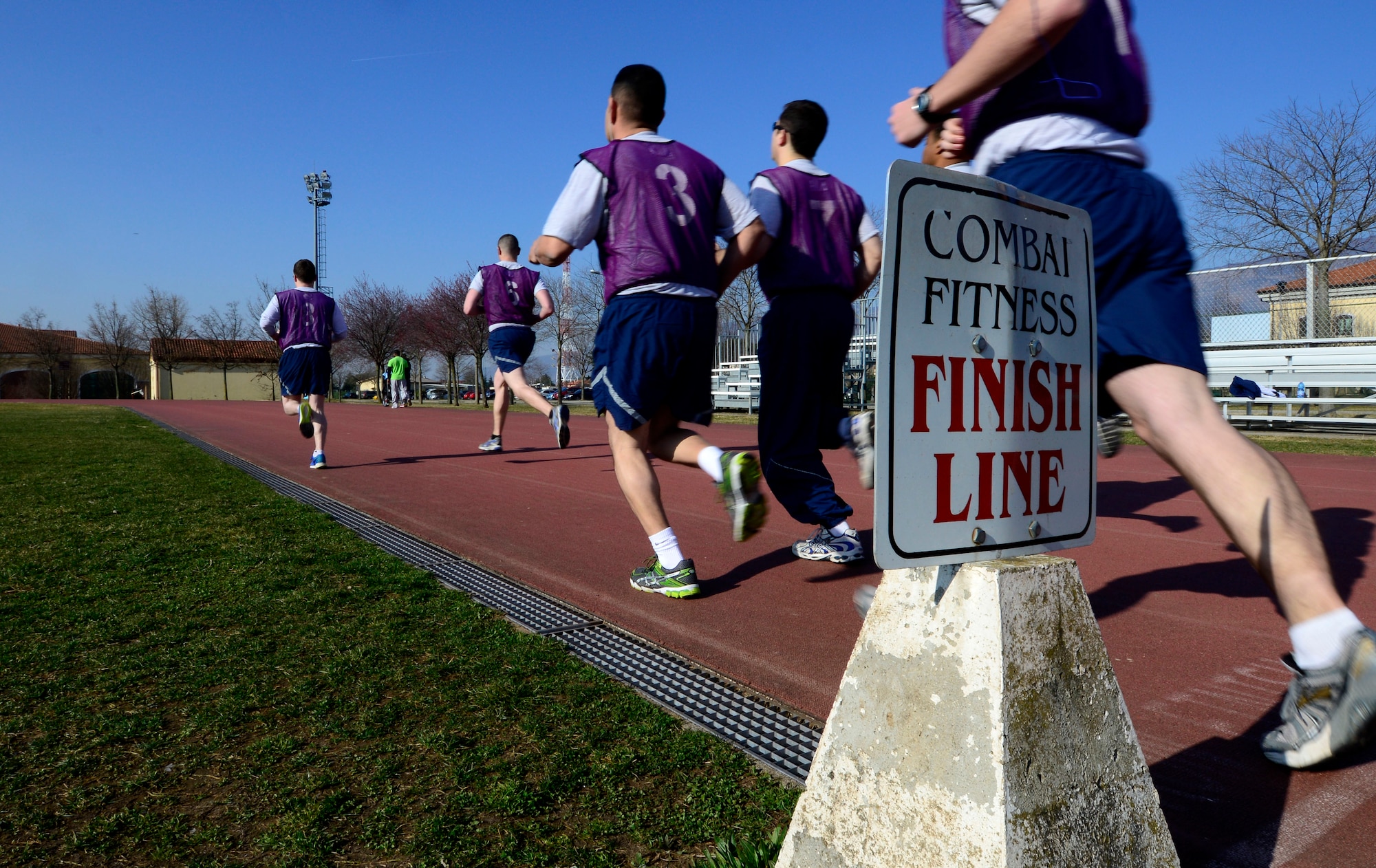 U.S. Air Force Airmen participate in the run portion of a physical fitness assessment test, March 11, 2015 at Aviano Air Base, Italy. Each portion of the test is recorded and awarded points based on age, gender, run time, number of push-ups and sit-ups to generate an Airman’s PT score. (U.S. Air Force photo by Senior Airman Areca T. Wilson/Released)