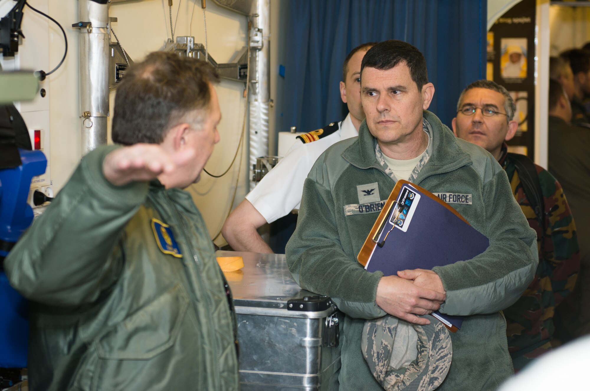 U.S. Air Force Col. David O’Brien, U.S. Transportation Command surgeon, listens to Royal Danish air force Maj. Claus Lie, 690th Squadron chief surgeon, at Ramstein Air Base, Germany, March 11, 2015. O’Brien and Lie both attended the Ramstein Aerospace Medicine Summit and NATO Science and Technology Organization Technical Course to learn and develop each other’s medical skills. (U.S. Air Force photo/Staff Sgt. Armando A. Schwier-Morales) 