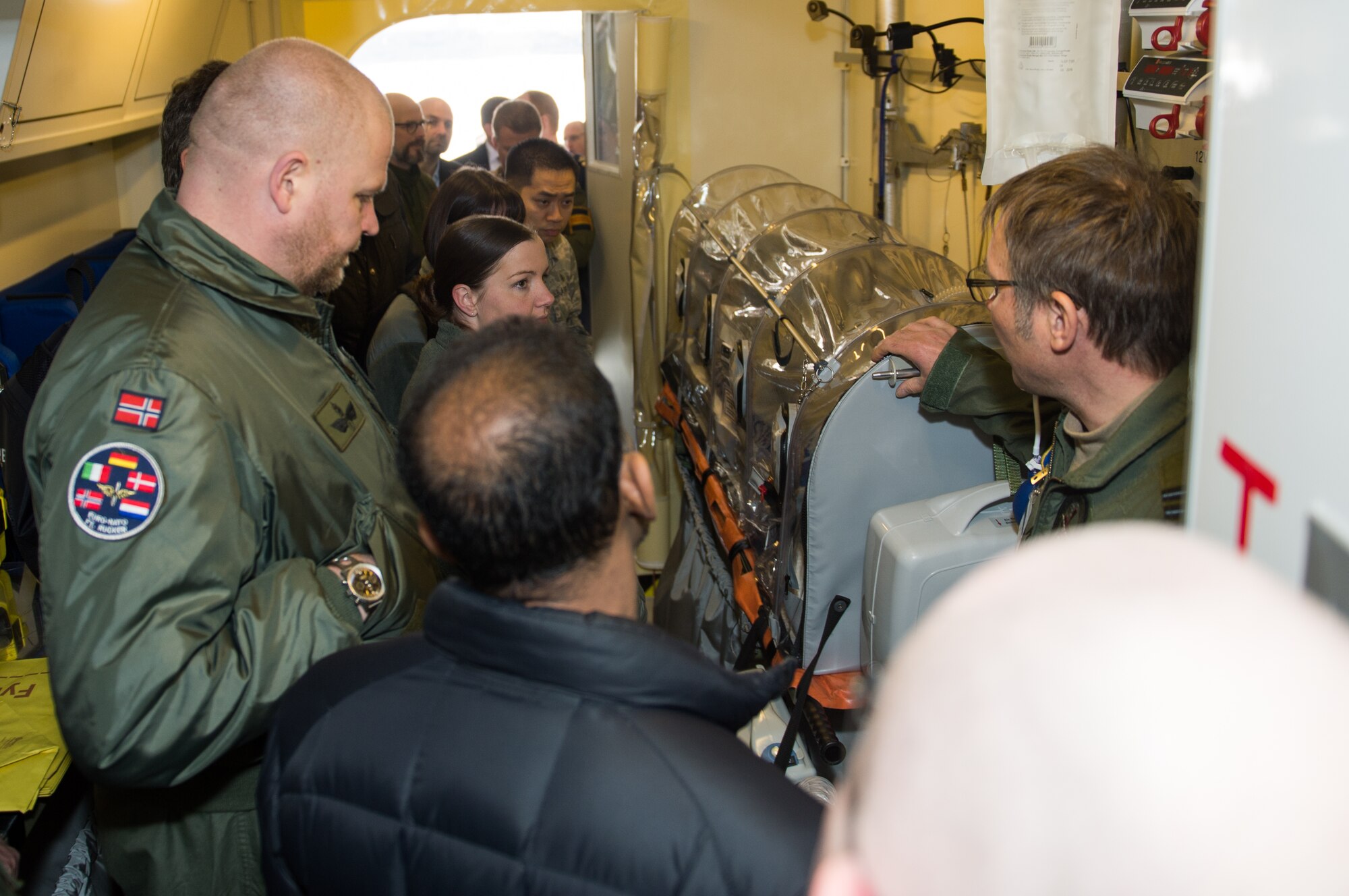 Airmen from Ramstein and international medical professionals tour a Royal Danish air force C-130J Super Hercules at Ramstein Air Base, Germany, March 11, 2015. During the 30th Ramstein Aerospace Medicine Summit and NATO Science and Technology Organization Technical Course, attendees learned about new technologies, methods and current practices to help develop each other’s medical programs. (U.S. Air Force photo/Staff Sgt. Armando A. Schwier-Morales) 