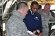 Air Force Reserve Senior Master Sgt. Phil Aliberti, 910th Airlift Wing aerial spray maintenance chief, shows an aerial spray nozzle to Air Mobility Command Commander Gen. Darren W. McDew, while 910th Maintenance Group Commander Col. David Post watches aboard a modified C-130H Hercules aircraft here, March 9, 2015. McDew met with wing leadership, toured the installation and got a close look at the 910th’s mission and capabilities. The 910th airlift Wing is home to the Department of Defense’s only large-area fixed-wing aerial spray capability. 