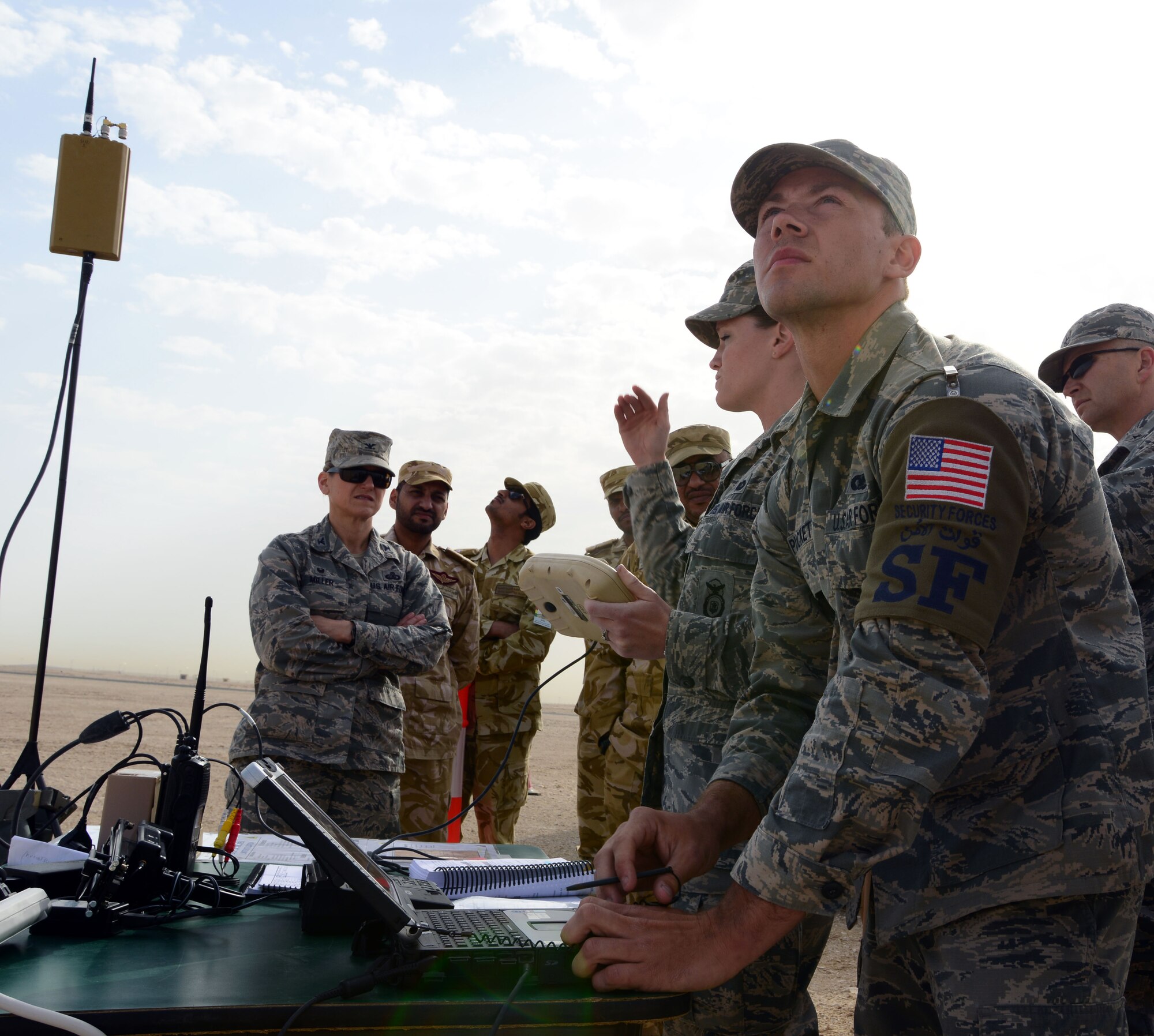 Airman Michael Puckett, 379th Expeditionary Security Forces Squadron, pilots an R-11B Raven during an aerial demonstration for senior Qatari Air Force and 379th Air Expeditionary Wing leaders, Mar 4, 2015, at Al Udeid Air Base, Qatar. The RQ-11 Raven is a lightweight unmanned aircraft system that’s designed for rapid deployment and high-mobility for military operations. At Al Udeid, security forces Airmen use the Raven to support anti-terrorism measures like day or night aerial intelligence, surveillance, target acquisition, and reconnaissance. This is the first time since 2005 that the Raven has been used at Al Udeid. (Air Force photo by Master Sgt. Kerry Jackson) 