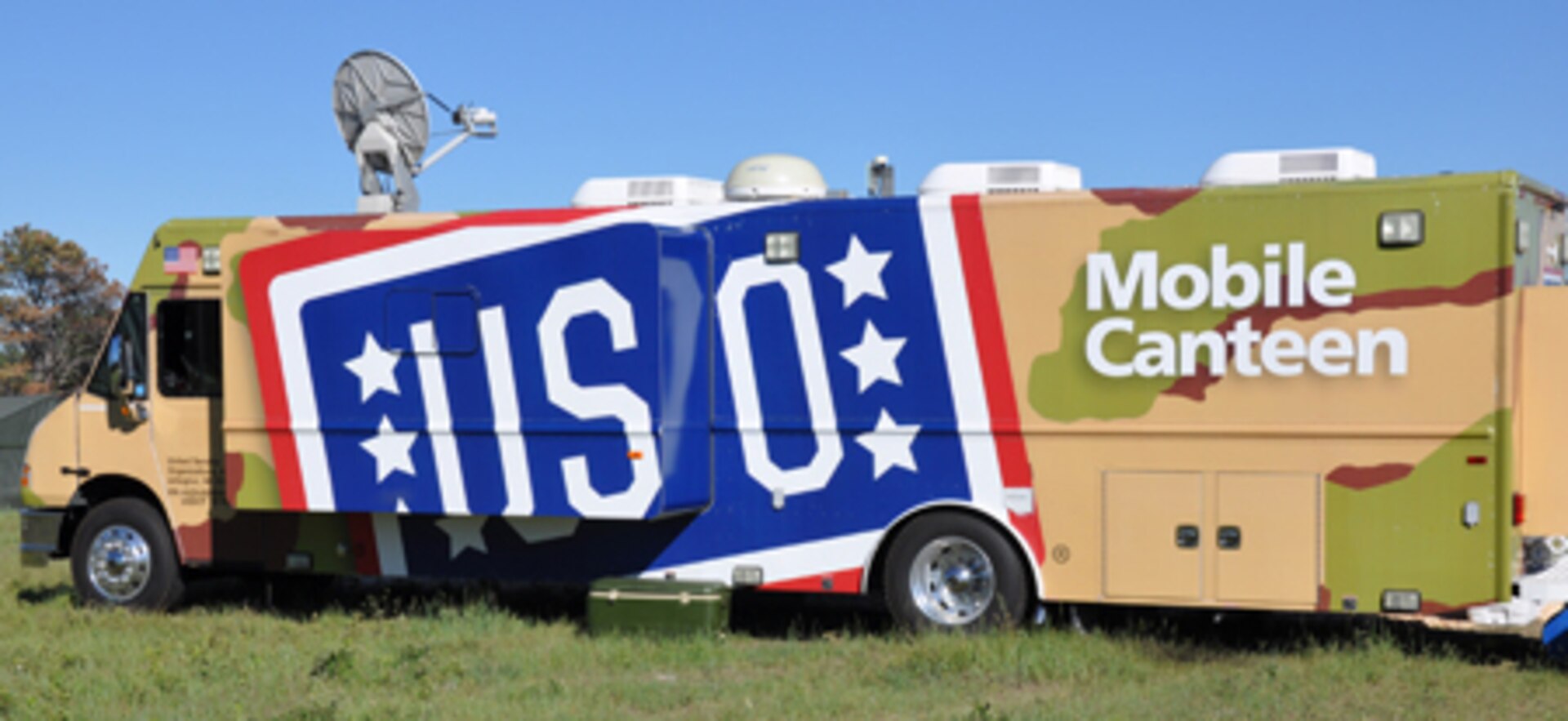 Service members stationed at the Custer State Park Airport during the 26th Annual Golden Coyote training exercise enjoyed various amenities offered by one of the Mobile USO vehicles that made its way up from Dallas, Texas. This mobile unit, which is only one of three in the country, is assigned to the central region of the U.S. The Mobile USO program is designed to support troops in remote or isolated areas throughout the United States by allowing them to relax and connect with friends and family during their down time.
