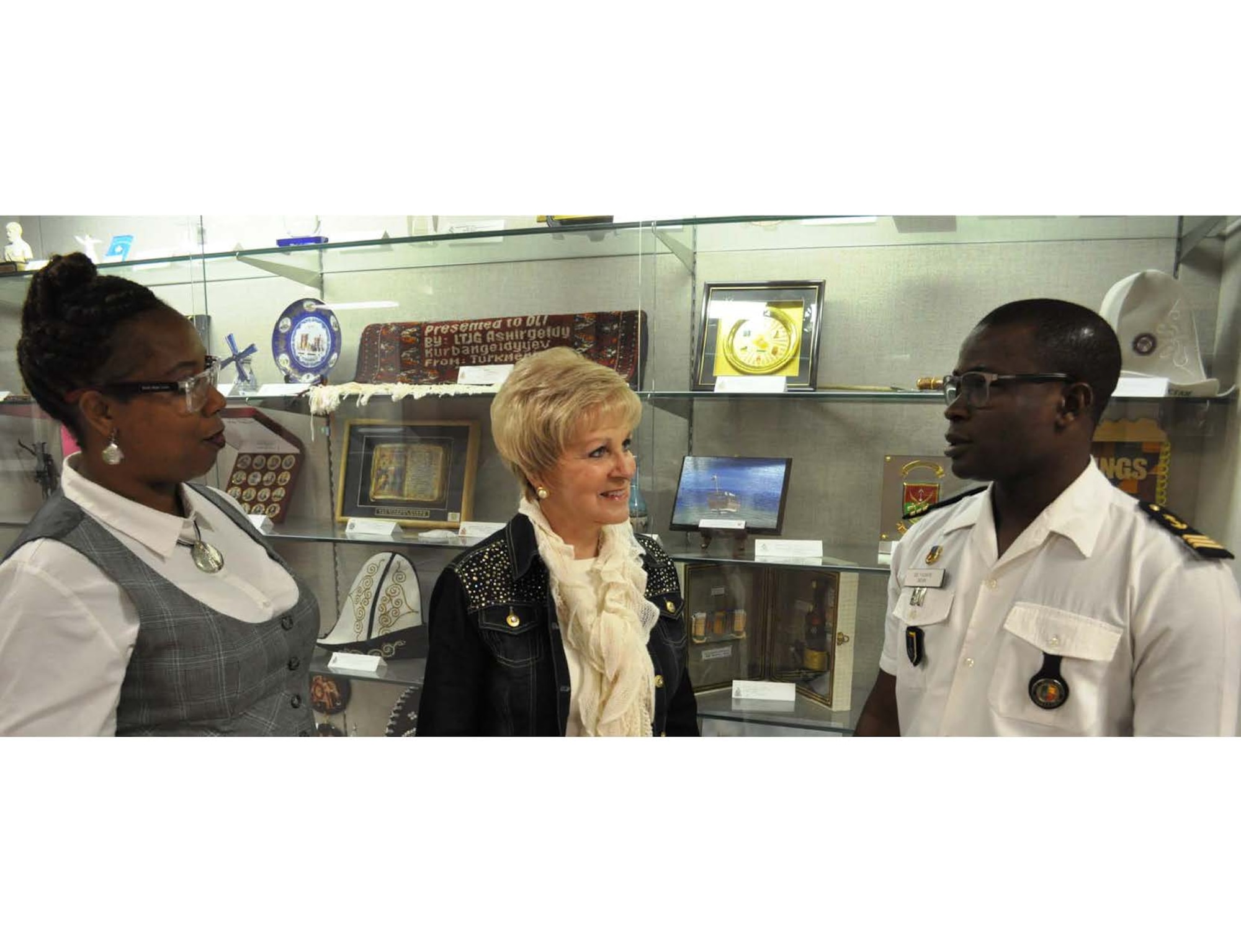 Dawna Hollie (left), Ambassador of the International Goodwill to Others (AMIGO) program manager, speaks with Jan Hall (center), an AMIGO sponsorship program volunteer, and Lt. Aboudou Ganihou Fadikpe (right), a Defense Language Institute English Language Center student at Joint Base San Antonio-Lackland. The DLIELC hosts the AMIGO program to create an opportunity for students to have a more personable American cultural experience and a chance to practice the English language. (Courtesy photo)
