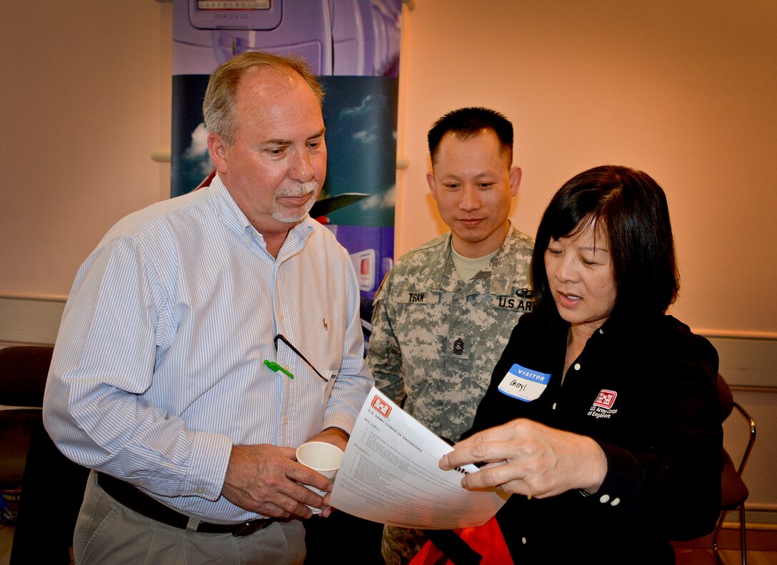 A U.S. Navy veteran listens to Human Resource Manager MSG Lam Tran and Cheryl Hiraoka, South Pacific Division Human Resources Director, about the benefits of working with the Corps of Engineers. More than 600 veterans attended the first “Honor a Hero, Hire a Vet” job fair hosted by the Employment Development Department of the State of California in the City of South San Francisco, Calif. on Monday, February 23, 2015.