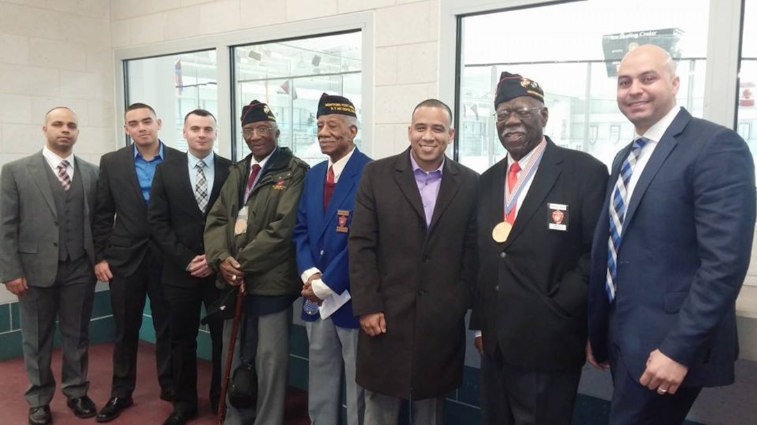 The Marines from Marine Corps Recruiting Substation Brooklyn pose for a photo with three of the original Montford Point Marines. Numerous Montford Point Marines spoke to the Marines of Recruiting Station New York about their experiences at the Bethpage Community Park Feb. 27. The Montford Point Marines fought two wars, one abroad and one at home. While they fought for freedom overseas, they returned home to a nation that was separate and unequal. Breaking through racial barriers, they transformed the face of the Marine Corps.