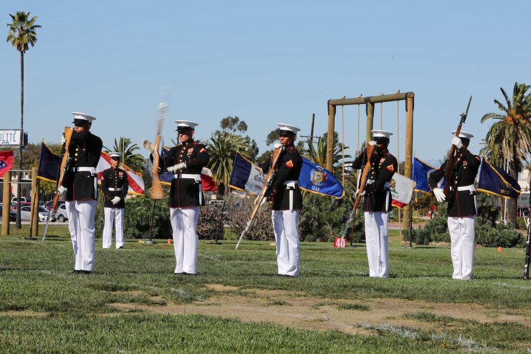 Marines with the Silent Drill Platoon spin their rifles during a Battle Colors Ceremony aboard Marine Corps Air Station Miramar, Calif., March 13. The Battle Colors Ceremony consists of a performance by the Silent Drill Platoon and “the Commandant’s Own” Drum and Bugle Corps.