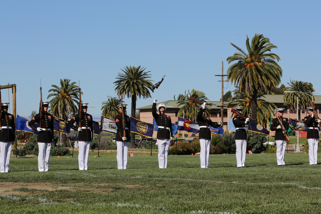 Marines with the Silent Drill Platoon throw their rifles during a Battle Colors Ceremony aboard Marine Corps Air Station Miramar, Calif., March 13. The Battle Colors Ceremony consists of a performance by the Silent Drill Platoon and “the Commandant’s Own” Drum and Bugle Corps.