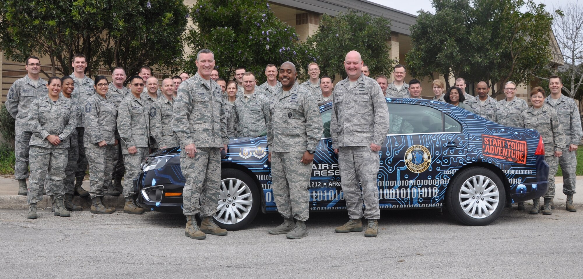 Maj. Gen. B. Edwin Wilson, 24th Air Force commander, spent time with the cyber Citizen Airmen during the 960th Cyberspace Operations Group’s commander’s forum hosted by Col. Lloyd Terry Jr., 960th CyOG commander March 7, 2015 at Joint Base San Antonio-Lackland, Texas.  Chief Master Sgt. William Fountas, 433rd Airlift Wing Recruiting Squadron flight chief brought the Reserve cyber recruiting car out for the day to show off to the 960th CyOG’s ‘gladiators of the grid’. (U.S. Air Force photo by 1st Lt. Lori Fiorello/Released)
