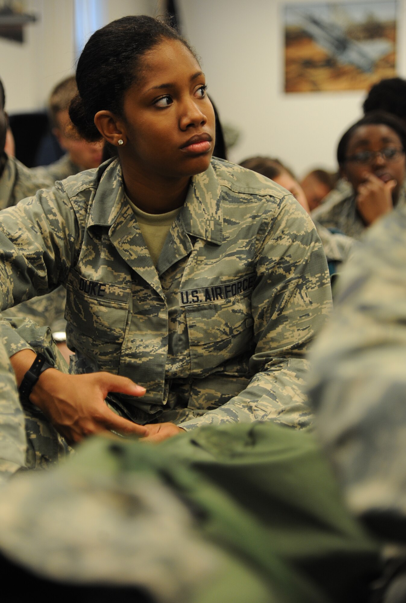 Airman Basic Marshe Duke, 335th Training Squadron student, watches a briefer discuss deployment issues during an “Introduction to Mobility” training day for non-prior service Airmen March 13, 2015, at Connor Manor, Keesler Air Force Base, Miss.  Airmen participated in pre-deployment training scenarios such as: going through a mobility processing line, administering self-aid and buddy care, reviewing the steps for chemical warfare gear and receiving a pre-deployment briefing.  The training was conducted to better prepare Keesler’s Airmen for deployment operations.  (U.S. Air Force photo by Kemberly Groue)