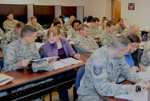Airmen and family members attend a Smooth Move briefing March 11, 2015, at Moody Air Force Base, Ga. The briefing taught Airmen how to prepare for a smooth permanent change of station. (U.S. Air Force photo by Airman Greg Nash/Released)